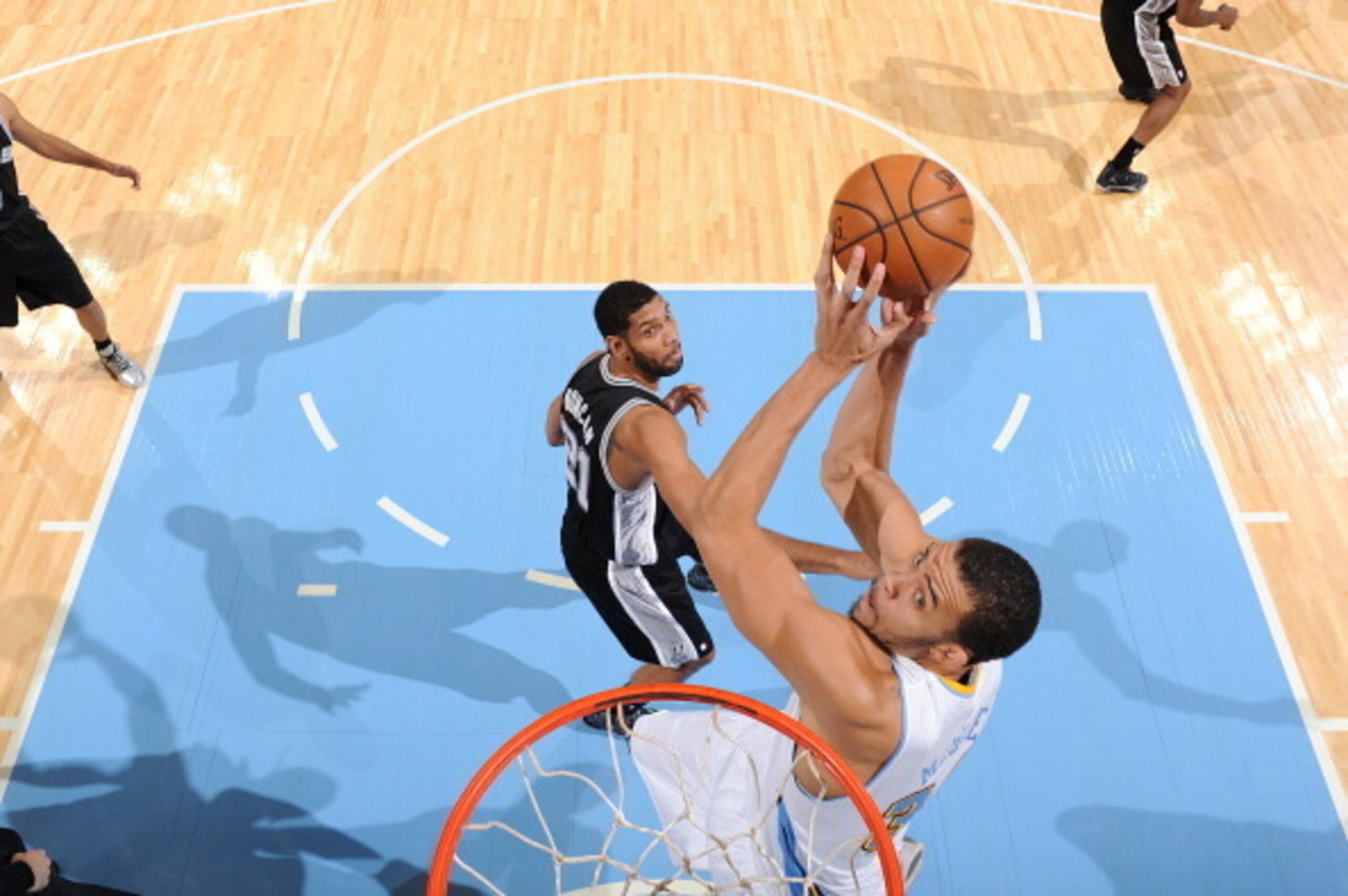 DENVER, CO - NOVEMBER 5: JaVale McGee #34 of the Denver Nuggets goes up for the reverse dunk against the San Antonio Spurs on November 5, 2013 at the Pepsi Center in Denver, Colorado. NOTE TO USER: User expressly acknowledges and agrees that, by downloadi