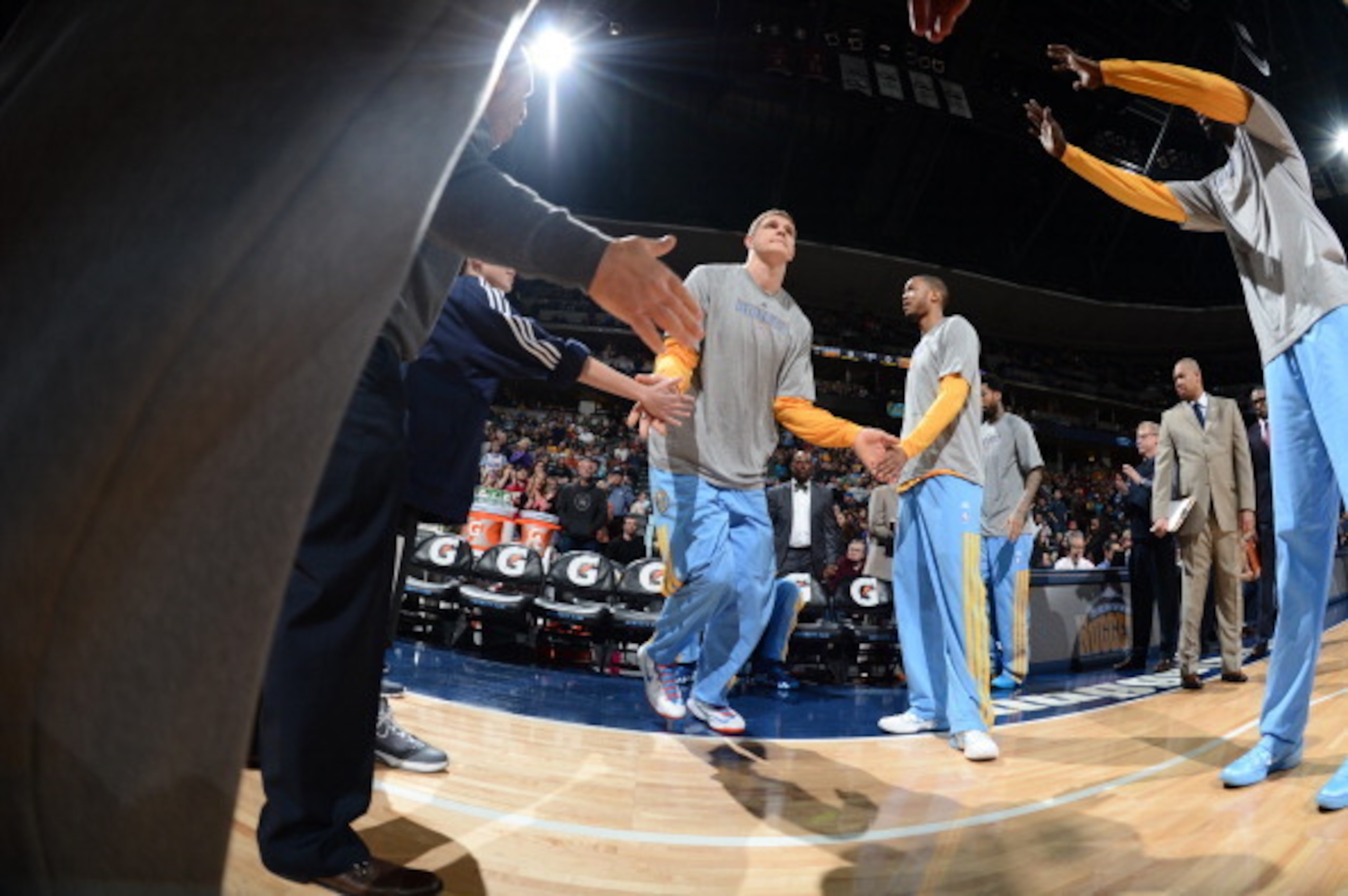 DENVER, CO - MARCH 7: Timofey Mozgov #25 of the Denver Nuggets is introduced before a game against the Los Angeles Lakers on March 7, 2014 at the Pepsi Center in Denver, Colorado. NOTE TO USER: User expressly acknowledges and agrees that, by downloading a