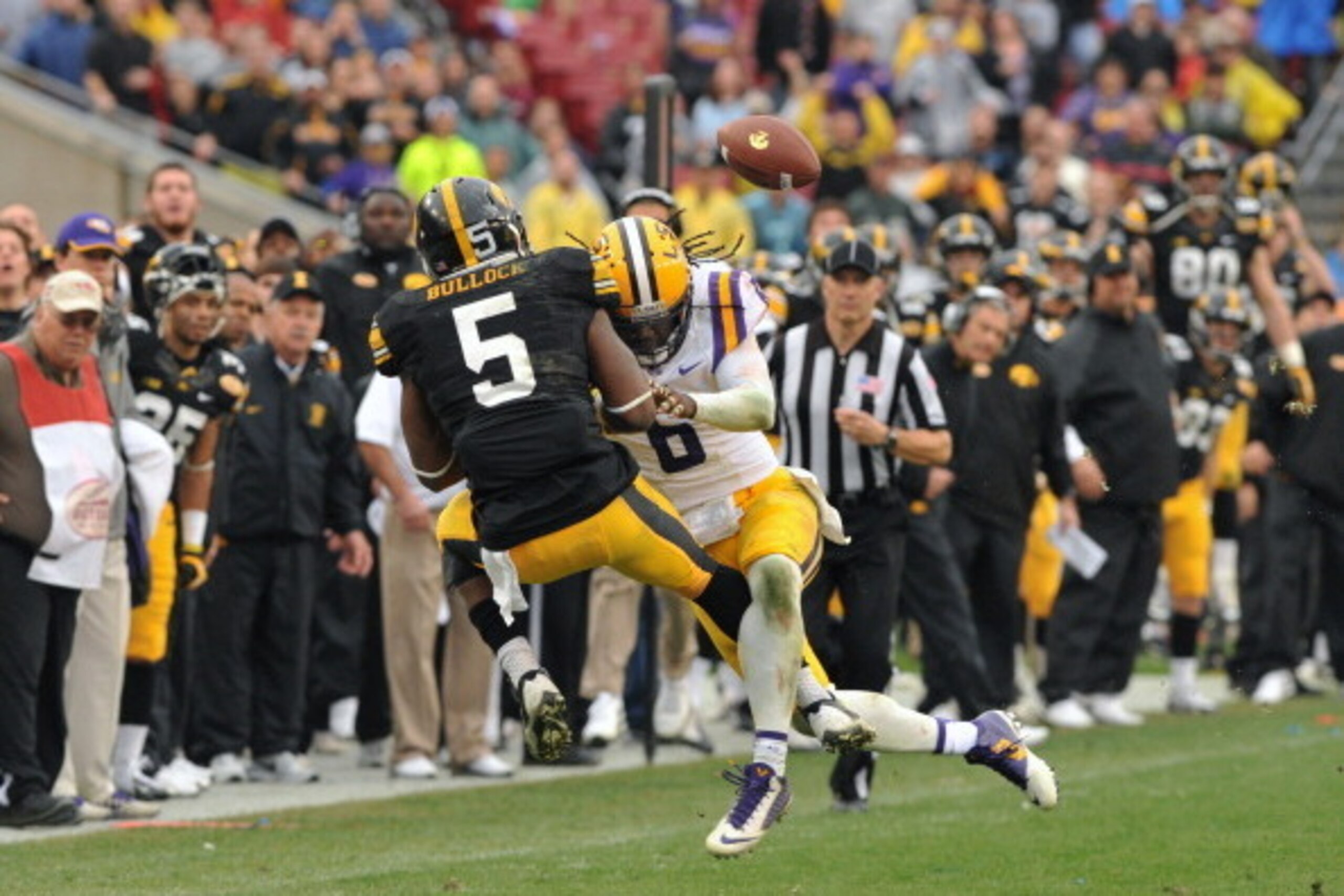 TAMPA, FL -  JANUARY 1:  Safety Craig Loston #6 of the LSU Tigers breaks up a pass intended for running back Damon Bullock #5 of the Iowa Hawkeyes January 1, 2014  in the Outback Bowl at Raymond James Stadium in Tampa, Florida.  LSU won 21 - 14. (Photo by