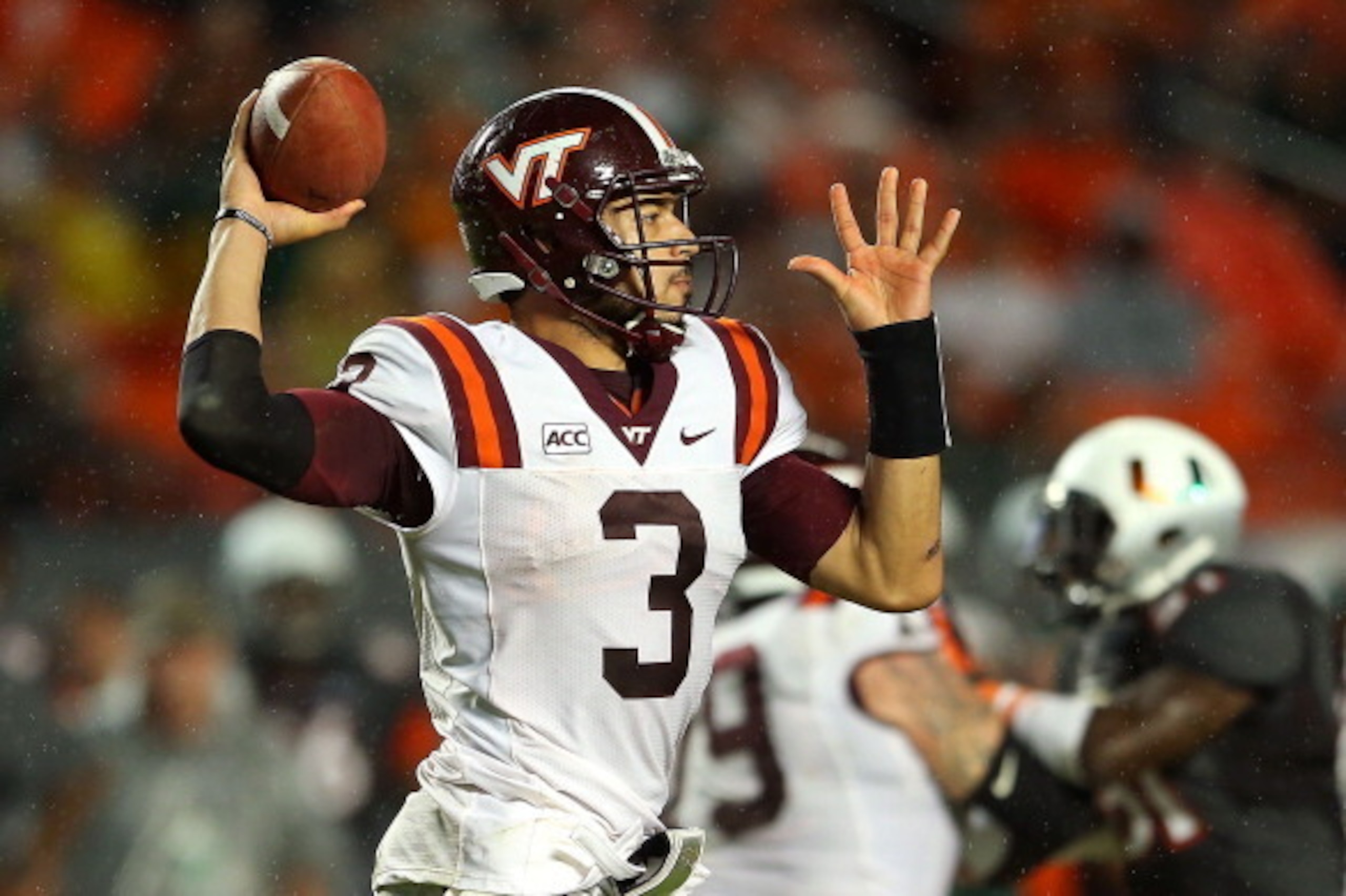MIAMI GARDENS, FL - NOVEMBER 09:  Logan Thomas #3 of the Virginia Tech Hokies passes during a game against the Miami Hurricanes at Sun Life Stadium on November 9, 2013 in Miami Gardens, Florida.  (Photo by Mike Ehrmann/Getty Images)