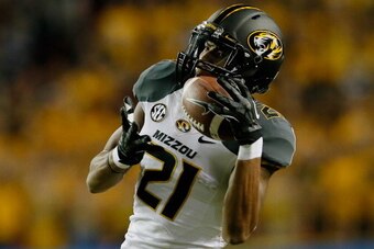 ATLANTA, GA - DECEMBER 07:  Wide receiver Bud Sasser #21 of the Missouri Tigers catches a reception in the third quarter against the Auburn Tigers during the SEC Championship Game at Georgia Dome on December 7, 2013 in Atlanta, Georgia.  (Photo by Kevin C