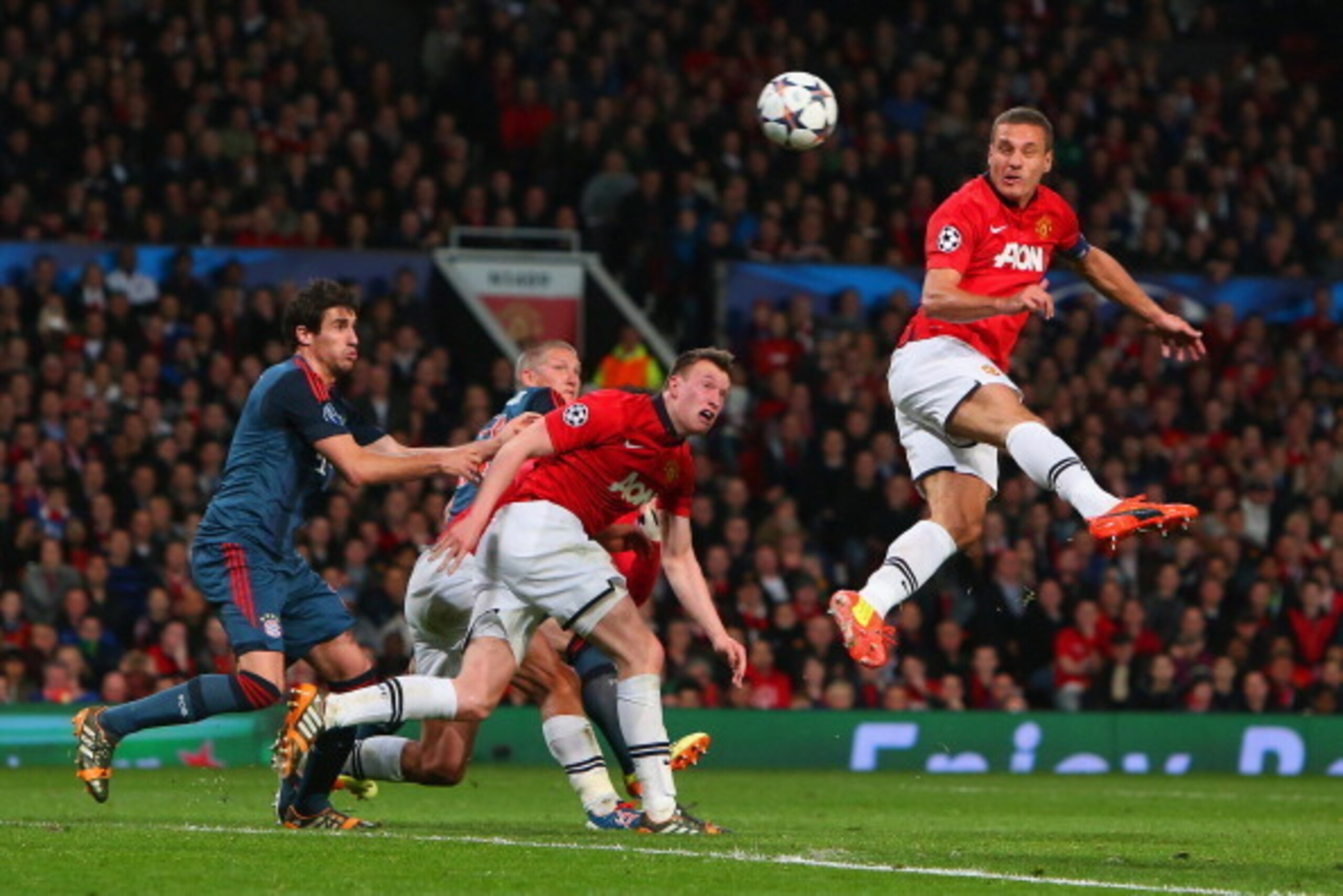 MANCHESTER, ENGLAND - APRIL 01:  Nemanja Vidic of Manchester United heads in the first goal during the UEFA Champions League Quarter Final first leg match between Manchester United and FC Bayern Muenchen at Old Trafford on April 1, 2014 in Manchester, Eng