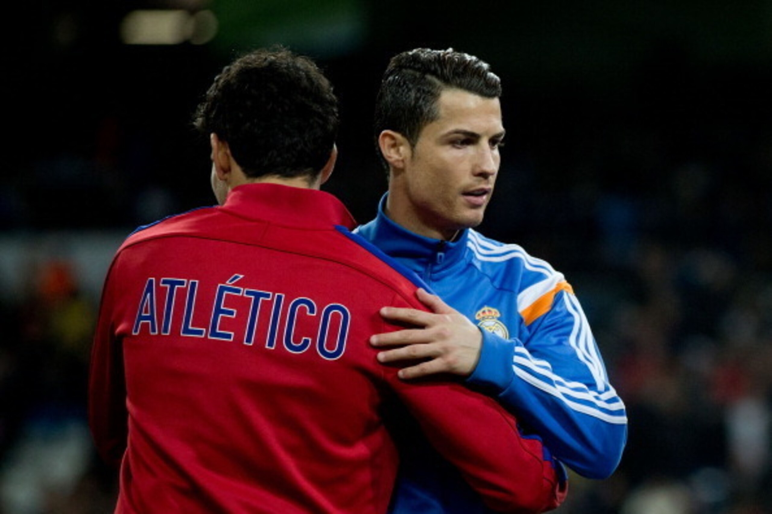 MADRID, SPAIN - FEBRUARY 05:  Cristiano Ronaldo (R) of Real Madrid CF embraces Diego Costa (L) of Atletico de Madrid prior to start prior to start the Copa del Rey semifinal first leg match between Real Madrid CF and Club Atletico Madrid at Estadio Santia