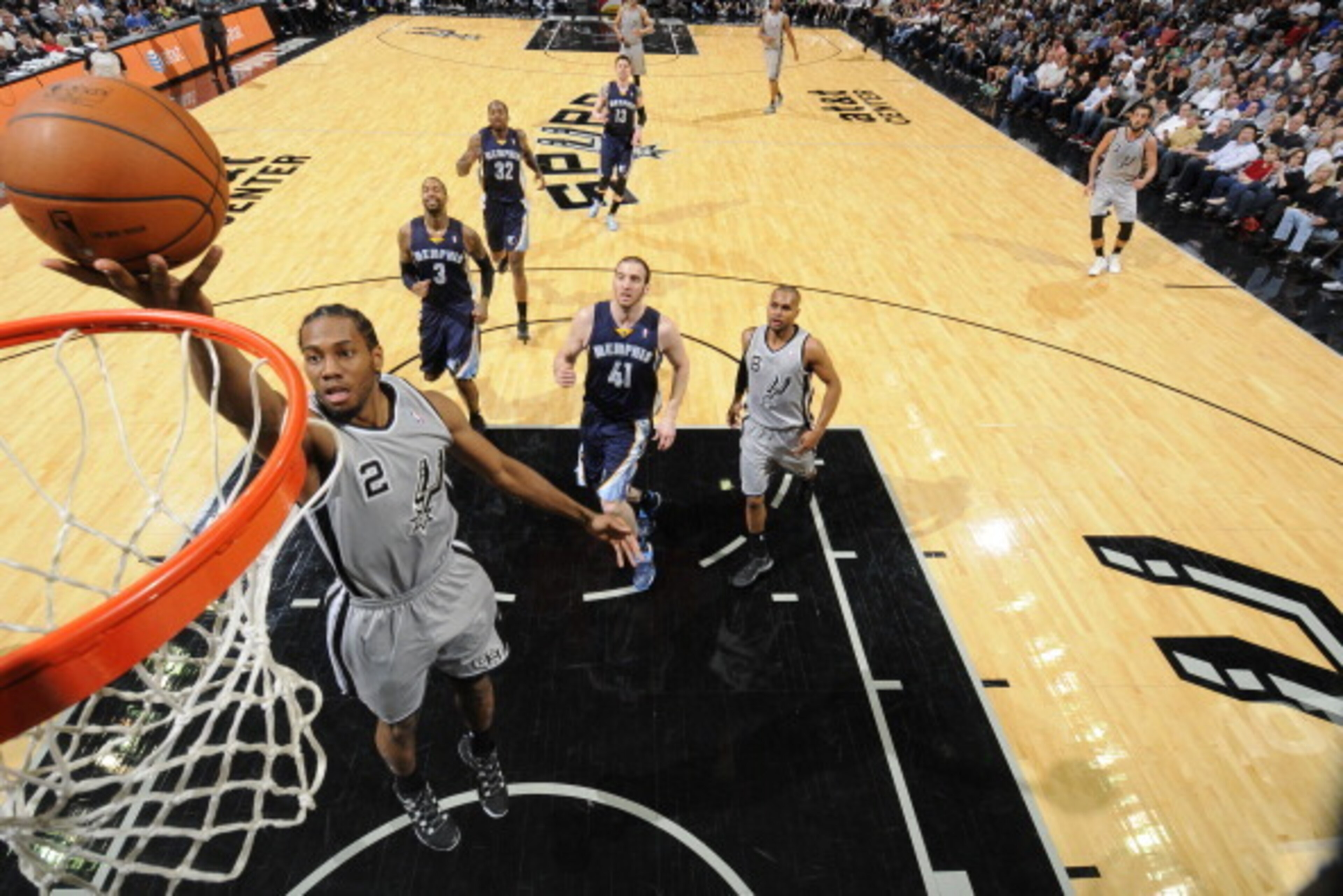 SAN ANTONIO, TX - April 6: Kawhi Leonard #2 of the San Antonio Spurs goes up for a shot against the Memphis Grizzlies at the AT&T Center on April 6, 2014 in San Antonio, Texas. NOTE TO USER: User expressly acknowledges and agrees that, by downloading and 