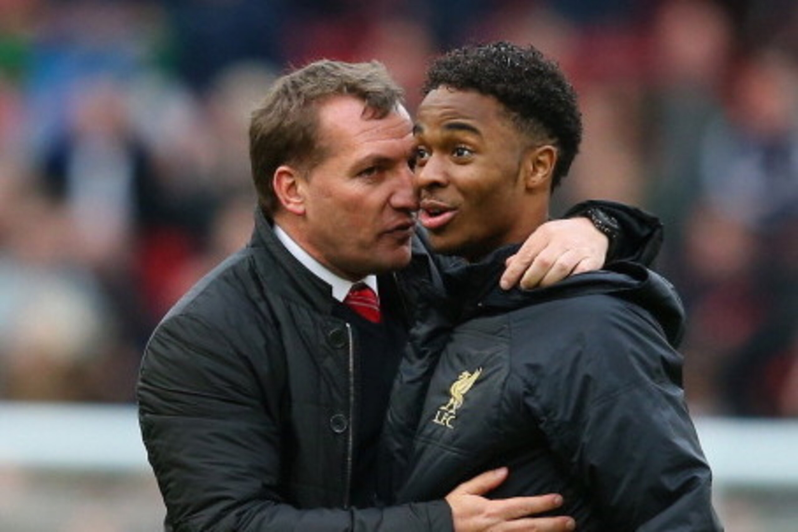 MANCHESTER, ENGLAND - MARCH 16:  Liverpool Manager Brendan Rodgers congratulates Raheem Sterling at the end of the Barclays Premier League match between Manchester United and Liverpool at Old Trafford on March 16, 2014 in Manchester, England.  (Photo by A