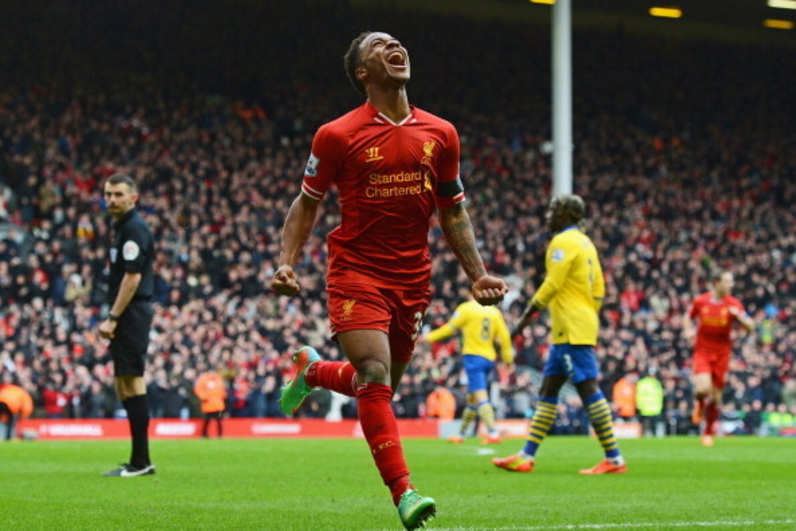 LIVERPOOL, ENGLAND - FEBRUARY 08:  Raheem Sterling of Liverpool celebrates scoring the fifth goal during the Barclays Premier League match between Liverpool and Arsenal at Anfield on February 8, 2014 in Liverpool, England.  (Photo by Michael Regan/Getty I