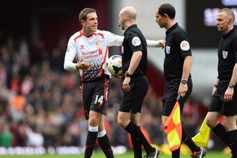 LONDON, ENGLAND - APRIL 06:  Jordan Henderson of Liverpool remonstrates with referee Anthony Taylor at half time after Guy Demel of West Ham scores a goal to level the scores at 1-1 during the Barclays Premier League match between West Ham United and Live
