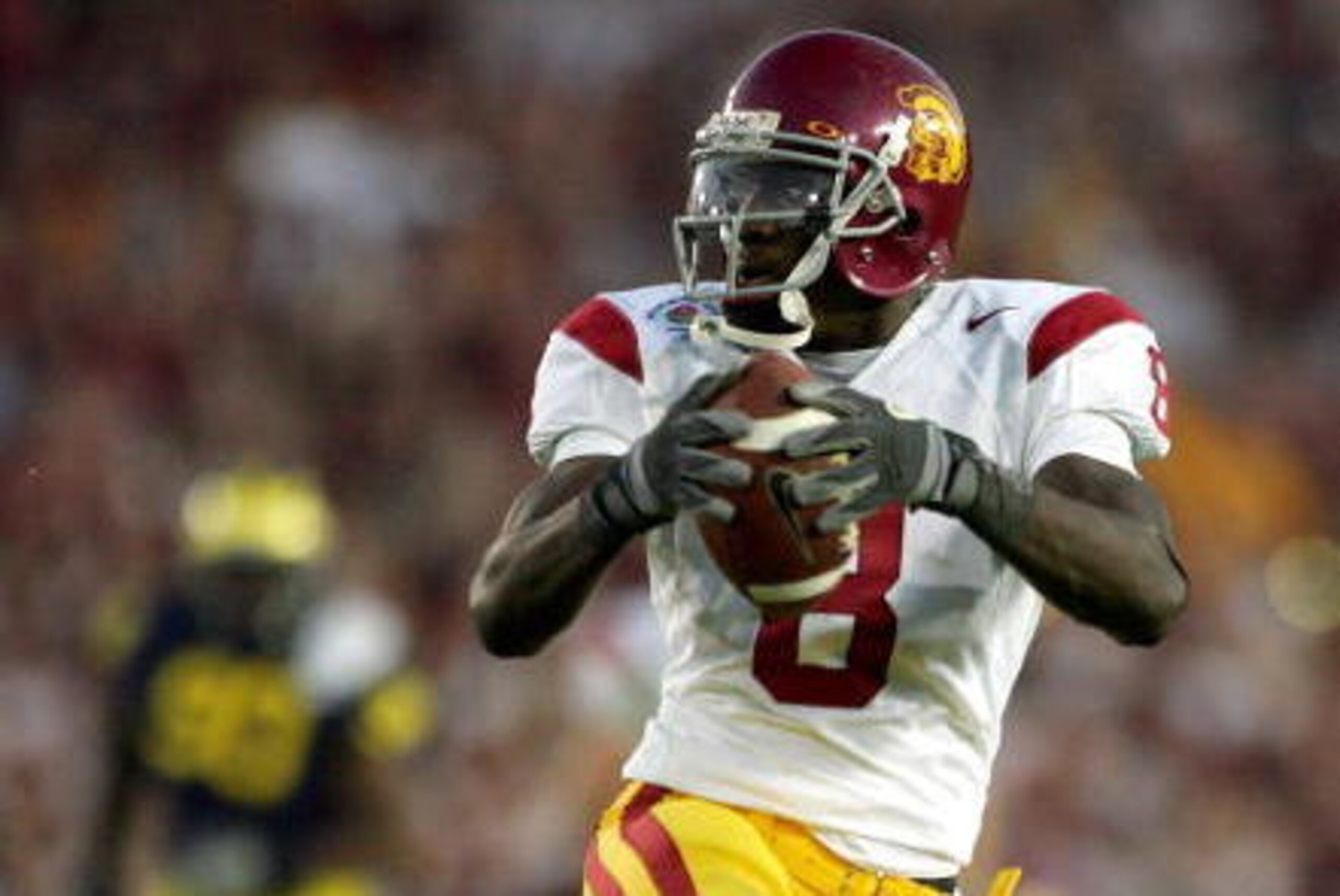 PASADENA, CA - JANUARY 01:  Dwayne Jarrett #8 of the USC Trojans runs in for a touchdown in the fourth quarter of the game with the Michigan Wolverines on January 1, 2007 at the Rose Bowl in Pasadena, California.  USC won the game 32-18 over Michigan.  (P