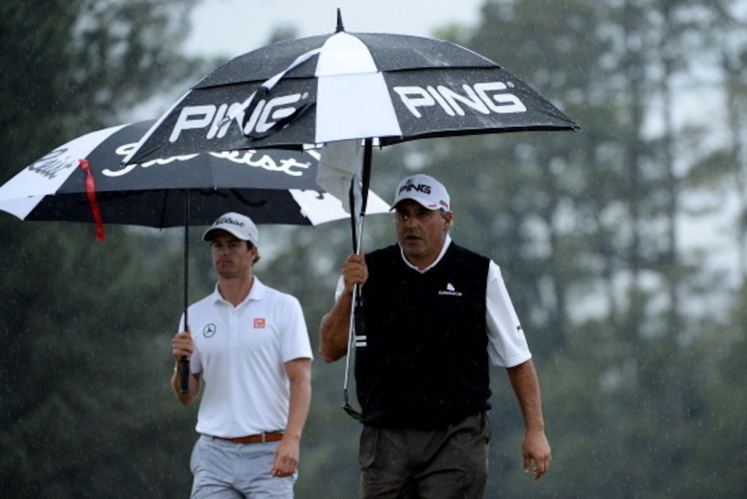 AUGUSTA, GA - APRIL 14:  Adam Scott of Australia walks alongside Angel Cabrera of Argentina during the final round of the 2013 Masters Tournament at Augusta National Golf Club on April 14, 2013 in Augusta, Georgia.  (Photo by Harry How/Getty Images)