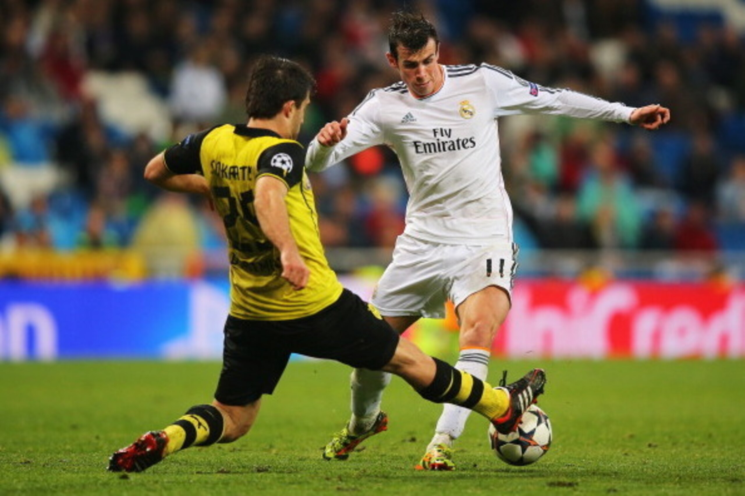 MADRID, SPAIN - APRIL 02:  Gareth Bale of Real Madrid takes on Sokratis Papastathopoulos of Borussia Dortmund during the UEFA Champions League Quarter Final first leg match between Real Madrid and Borussia Dortmund at Estadio Santiago Bernabeu on April 2,