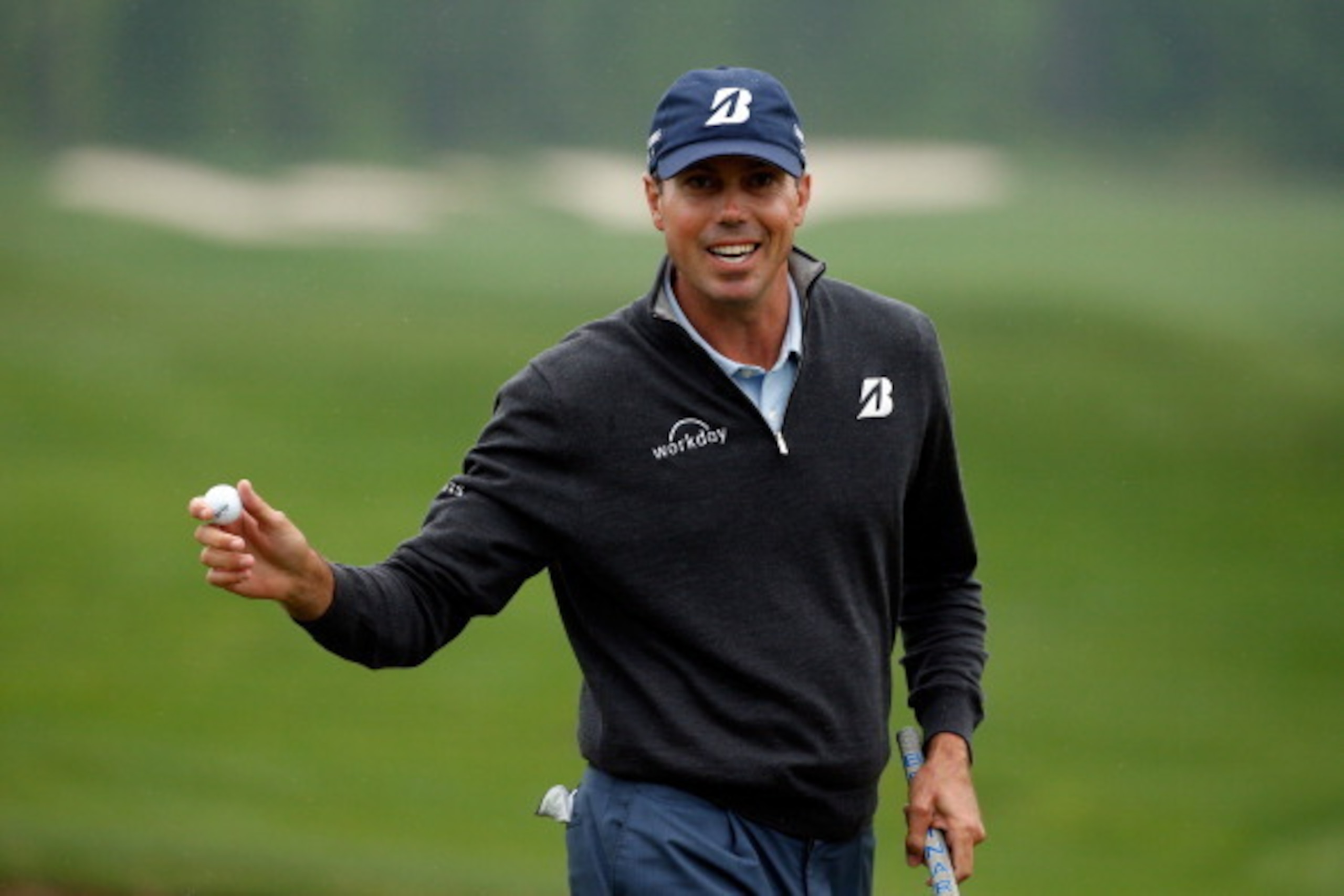 HUMBLE, TX - APRIL 06:  Matt Kuchar of the United States celebrates on the green after putting for birdie on the fifteenth hole during the final round of the Shell Houston Open at the Golf Club of Houston on April 6, 2014 in Humble, Texas.  (Photo by Scot