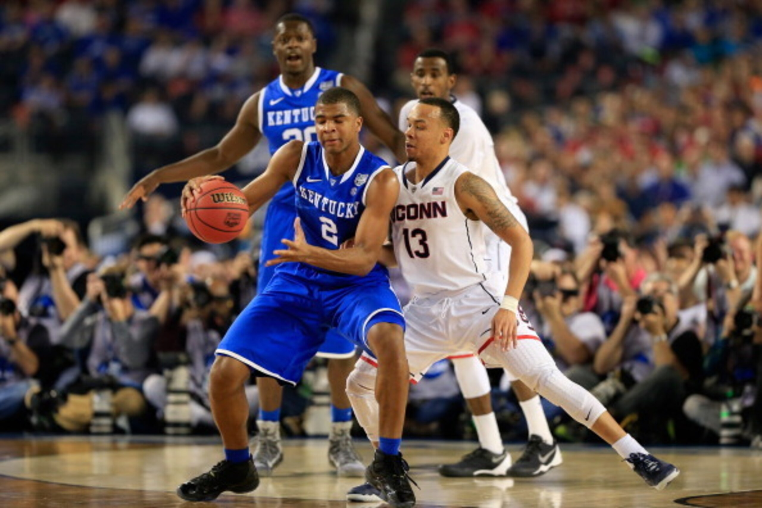 ARLINGTON, TX - APRIL 07: Shabazz Napier #13 of the Connecticut Huskies defends against Aaron Harrison #2 of the Kentucky Wildcats during the NCAA Men's Final Four Championship at AT&T Stadium on April 7, 2014 in Arlington, Texas.  (Photo by Jamie Squire/