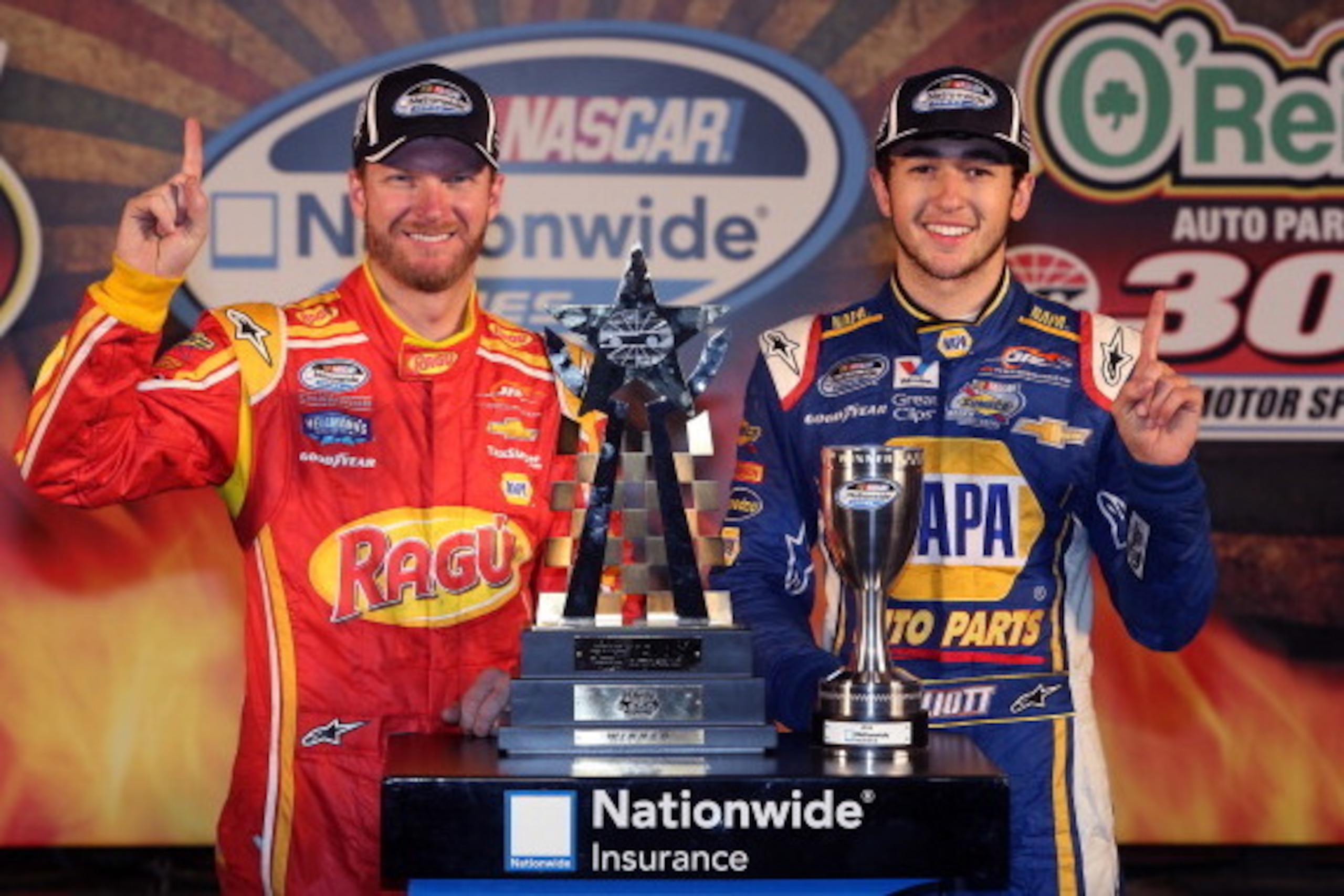 FORT WORTH, TX - APRIL 04:  Chase Elliott, driver of the #9 NAPA Auto Parts Chevrolet, celebrates in victory lane with Dale Earnhardt Jr., driver of the #88 Ragu Chevrolet, after winning the NASCAR Nationwide Series O'Reilly Auto Parts 300 at Texas Motor 