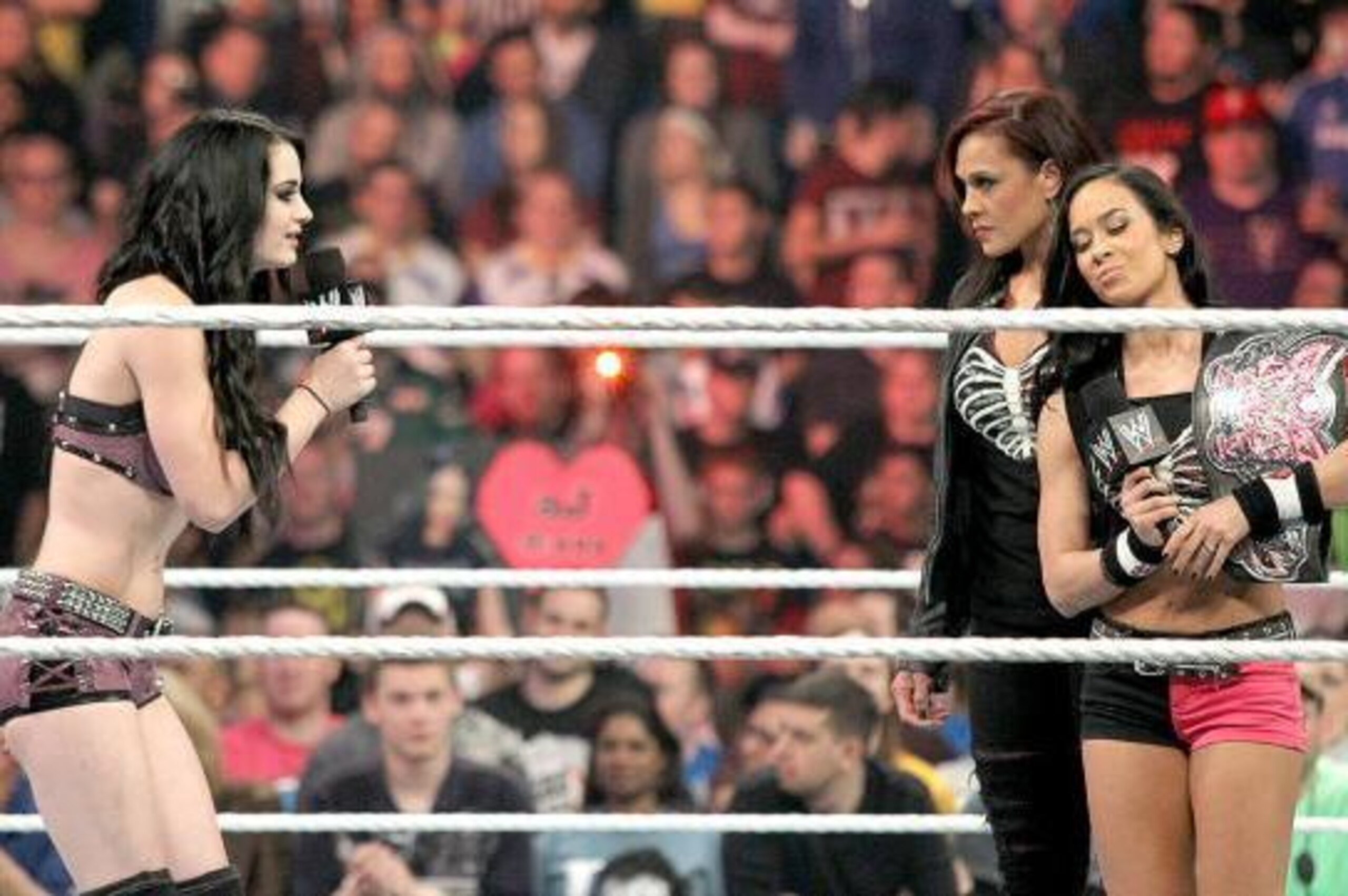 Paige tries to congratulate AJ Lee.