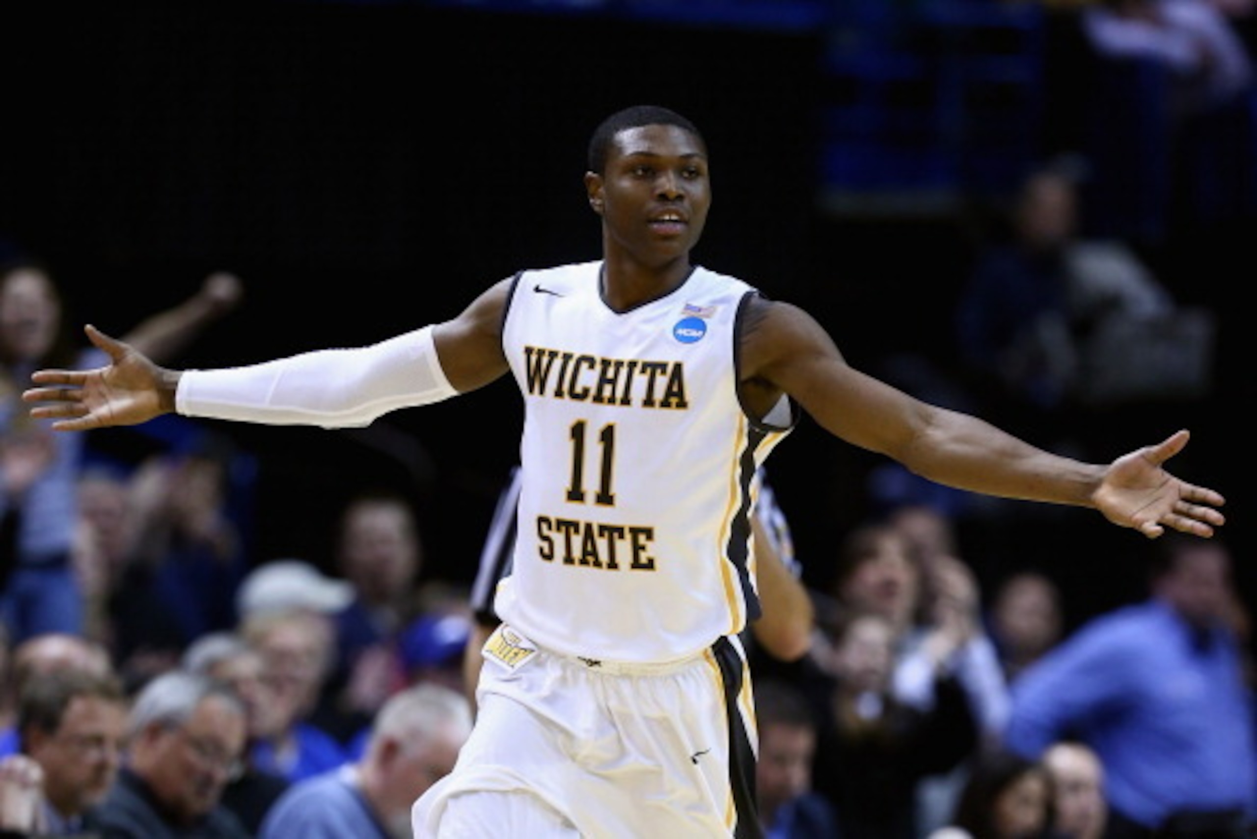 ST LOUIS, MO - MARCH 23:  Cleanthony Early #11 of the Wichita State Shockers celebrates after a basket in the second half against the Kentucky Wildcats during the third round of the 2014 NCAA Men's Basketball Tournament at Scottrade Center on March 23, 20