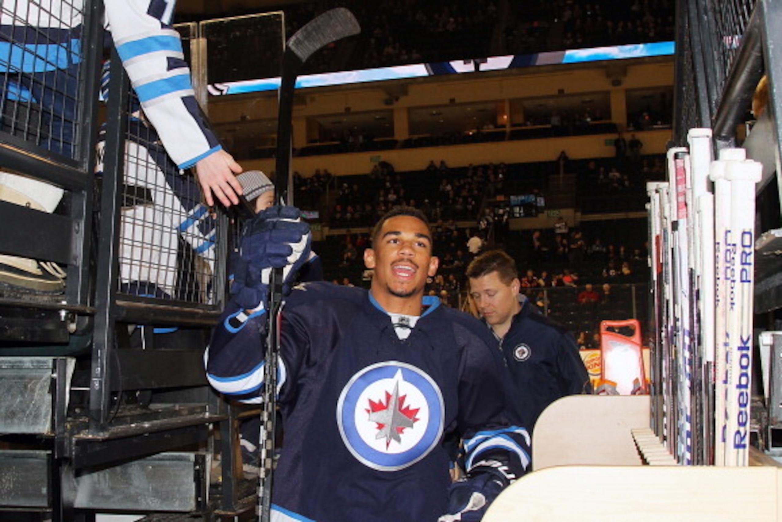 WINNIPEG, MB - MARCH 12: Evander Kane #9 of the Winnipeg Jets heads off the ice following the pre-game warm up prior to NHL action against the Vancouver Canucks at the MTS Centre on March 12, 2014 in Winnipeg, Manitoba, Canada. (Photo by Jonathan Kozub/NH