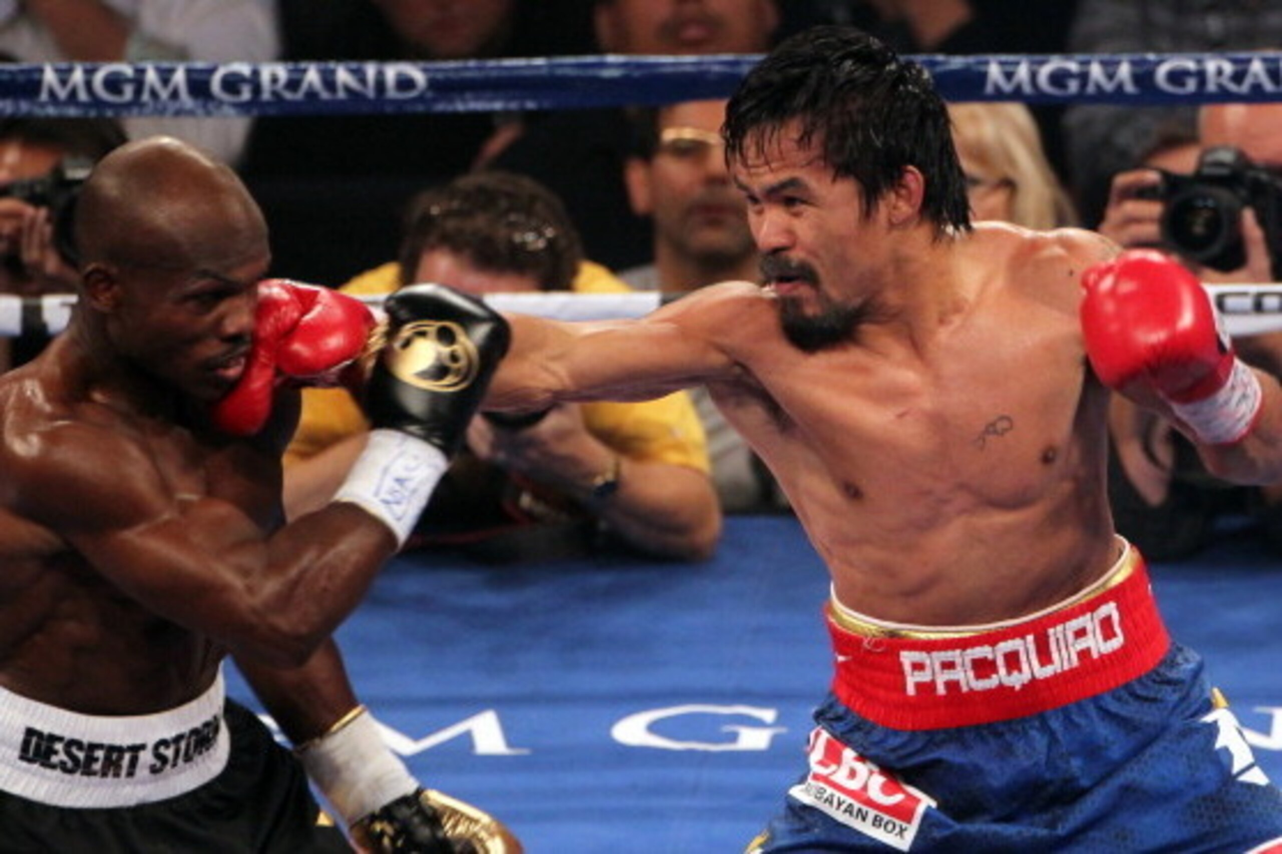LAS VEGAS, NV - JUNE 09: (R-L) Manny Pacquiao lands a right to the head of Timothy Bradley during their WBO welterweight title fight at MGM Grand Garden Arena on June 9, 2012 in Las Vegas, Nevada. (Photo by Jeff Bottari/Getty Images) LAS VEGAS, NV - JUNE 09: (R-L) Manny Pacquiao lands a right to the head of Timothy Bradley during their WBO welterweight title fight at MGM Grand Garden Arena on June 9, 2012 in Las Vegas, Nevada. (Photo by Jeff Bottari/Getty Images)