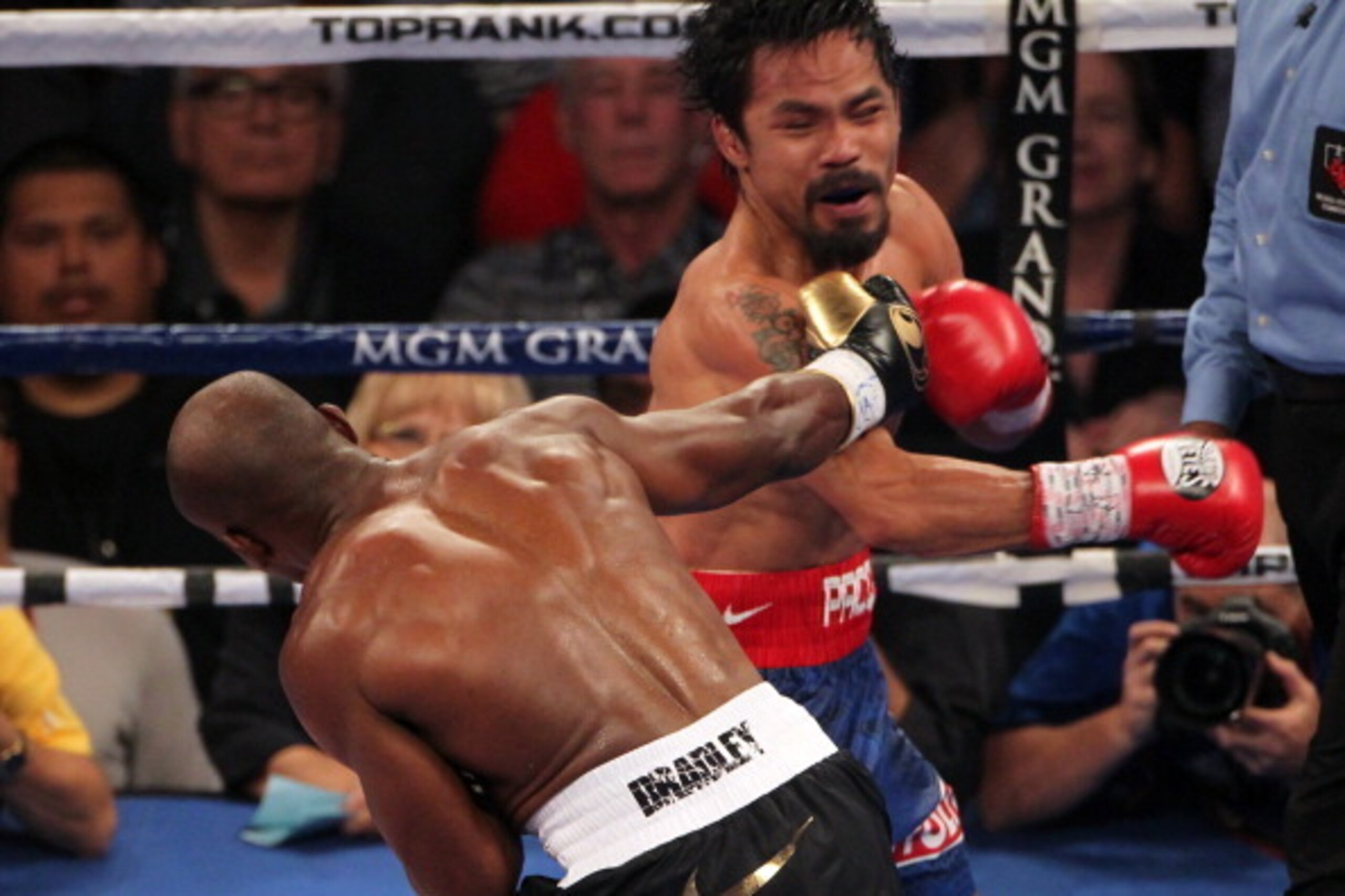 LAS VEGAS, NV - JUNE 09: (L-R) Timothy Bradley lands a right to the head of Manny Pacquiao during their WBO welterweight title fight at MGM Grand Garden Arena on June 9, 2012 in Las Vegas, Nevada. (Photo by Jeff Bottari/Getty Images) LAS VEGAS, NV - JUNE 09: (L-R) Timothy Bradley lands a right to the head of Manny Pacquiao during their WBO welterweight title fight at MGM Grand Garden Arena on June 9, 2012 in Las Vegas, Nevada. (Photo by Jeff Bottari/Getty Images)