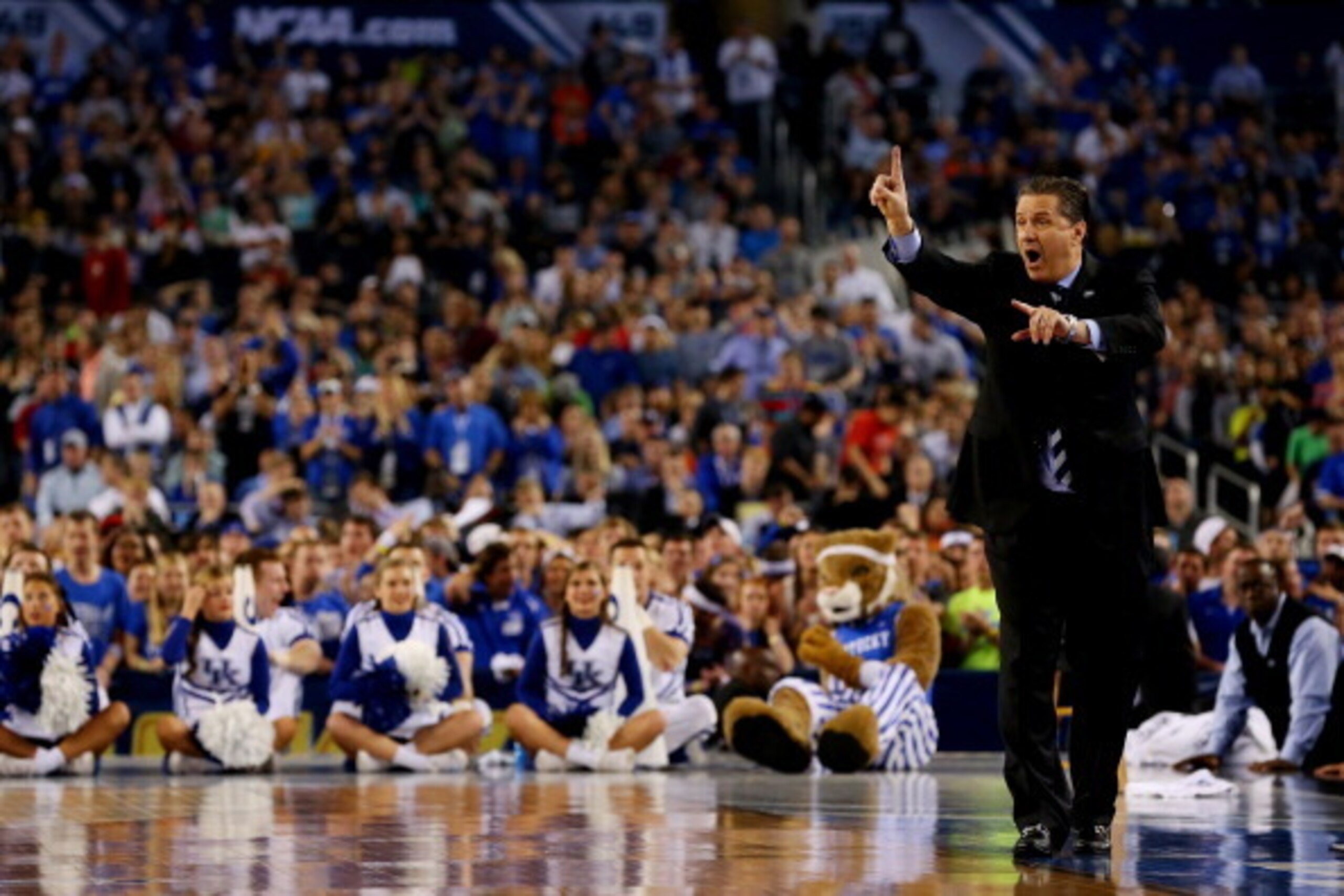 ARLINGTON, TX - APRIL 07:  Head coach John Calipari of the Kentucky Wildcats motions to his players during the NCAA Men's Final Four Championship against the Connecticut Huskies at AT&T Stadium on April 7, 2014 in Arlington, Texas.  (Photo by Ronald Marti