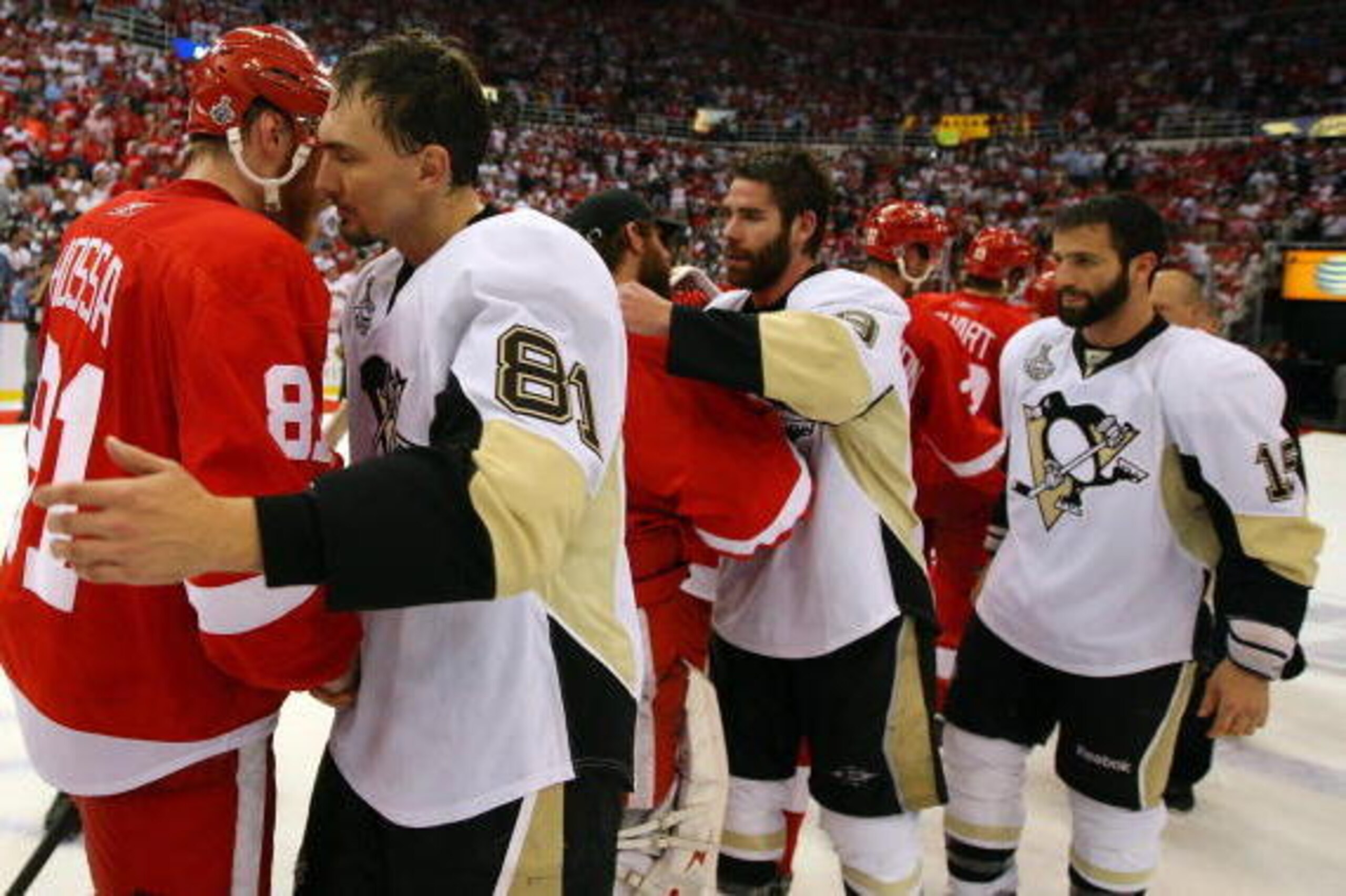 DETROIT - JUNE 12:  Miroslav Satan #81 of the Pittsburgh Penguins shakes hands with Marian Hossa #81 of the Detroit Red Wings after Game Seven of the 2009 NHL Stanley Cup Finals at Joe Louis Arena on June 12, 2009 in Detroit, Michigan.  (Photo by Jim McIs