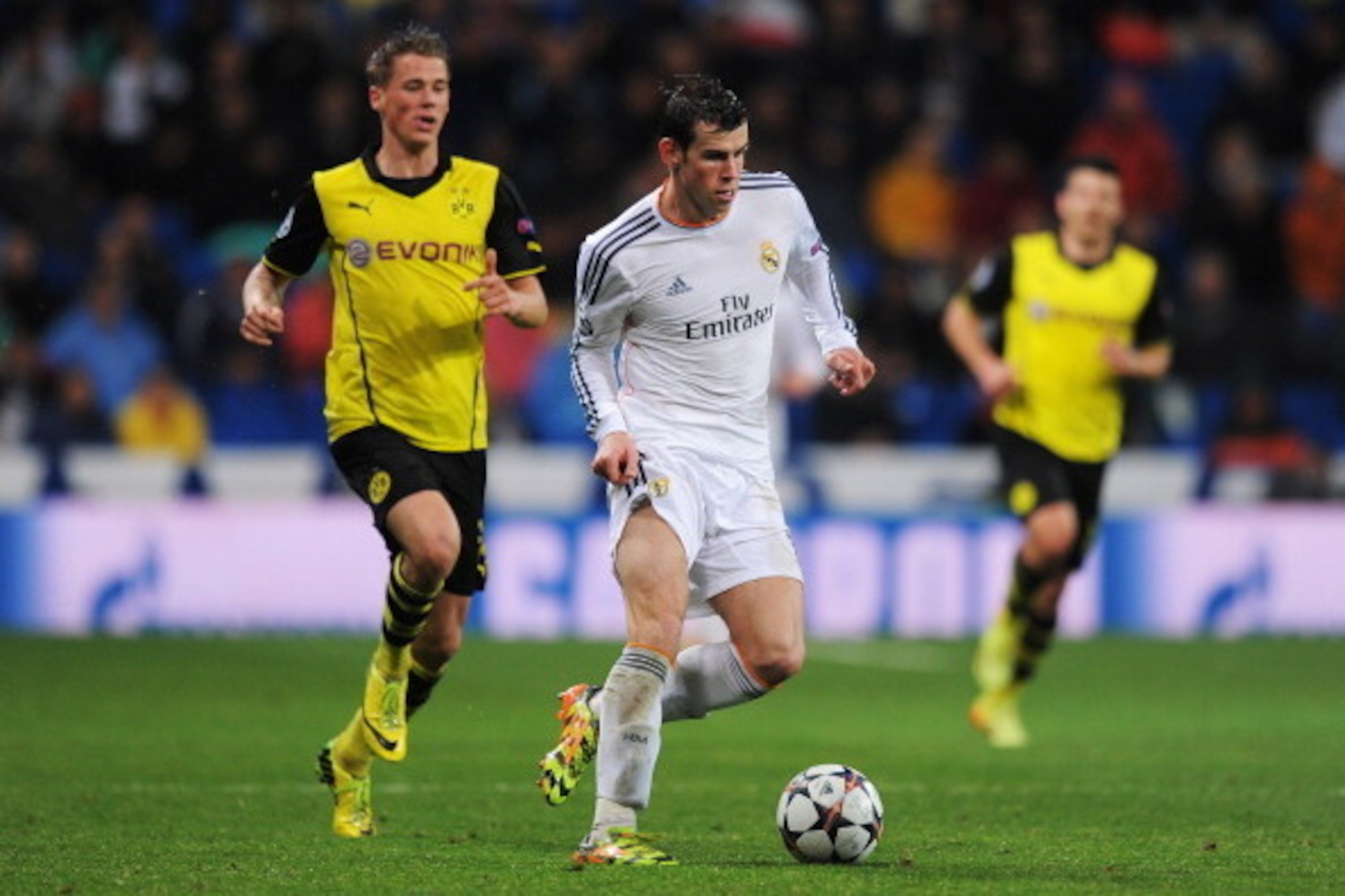 MADRID, SPAIN - APRIL 02:  Gareth Bale of Real Madrid goes past Erik Durm of Borussia Dortmund during the UEFA Champions League Quarter Final first leg match between Real Madrid and Borussia Dortmund at Estadio Santiago Bernabeu on April 2, 2014 in Madrid