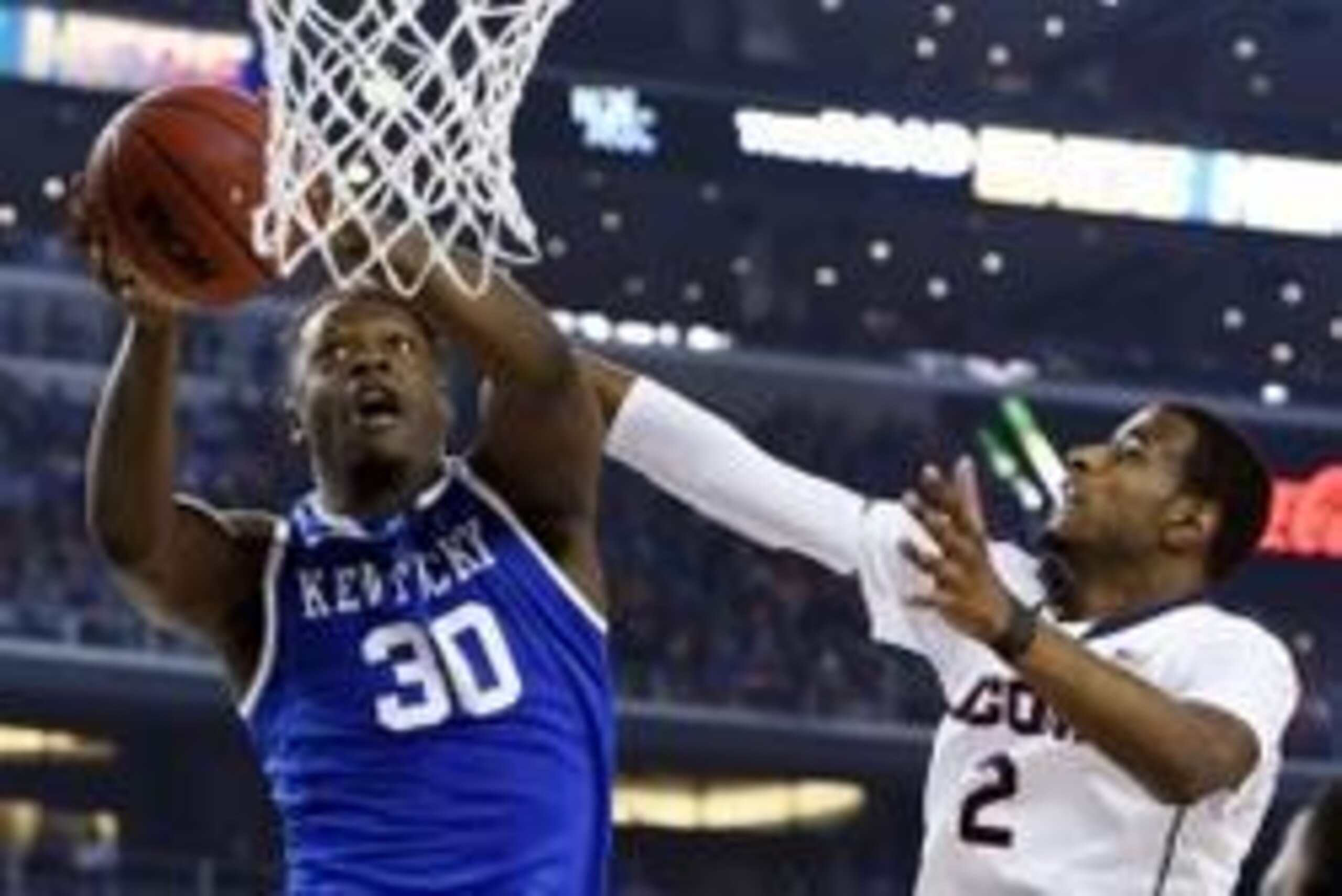 Apr 7, 2014; Arlington, TX, USA; Kentucky Wildcats forward Julius Randle (30) shoots against Connecticut Huskies forward DeAndre Daniels (2) in the second half during the championship game of the Final Four in the 2014 NCAA Mens Division I Championship to