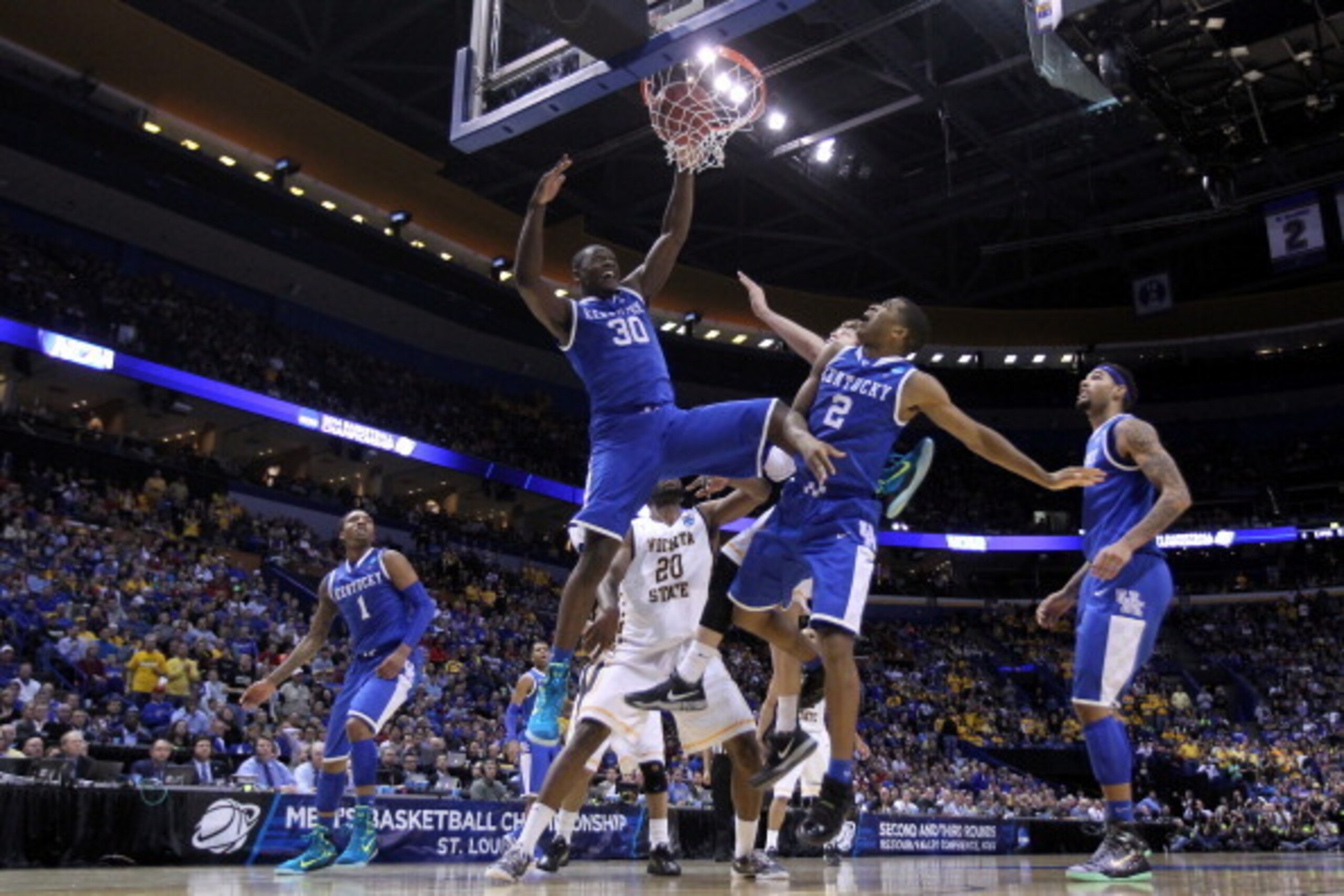 ST LOUIS, MO - MARCH 23:  Julius Randle #30 of the Kentucky Wildcats dunks the ball against the Wichita State Shockers during the third round of the 2014 NCAA Men's Basketball Tournament at Scottrade Center on March 23, 2014 in St Louis, Missouri.  (Photo