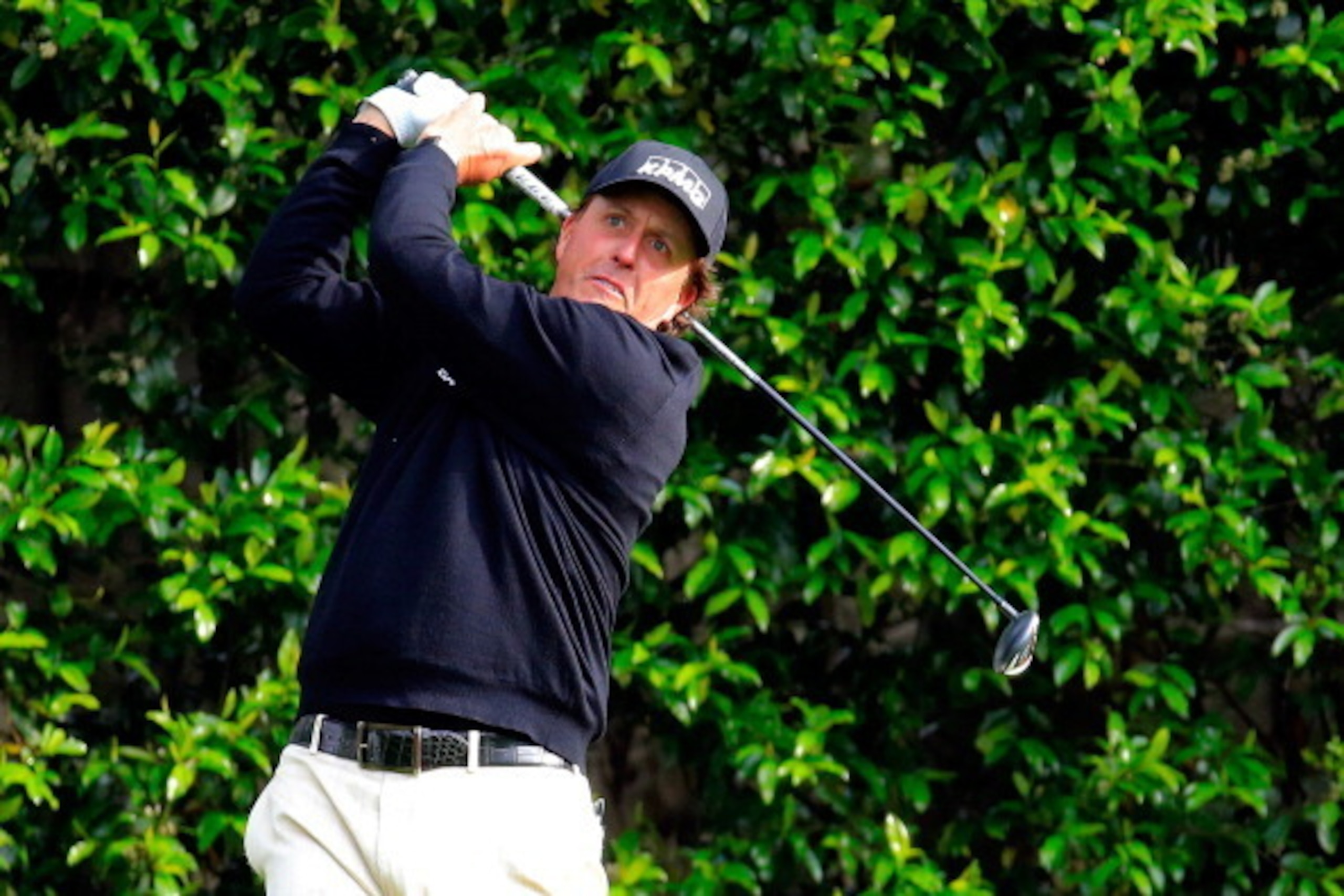 AUGUSTA, GA - APRIL 08:  Phil Mickelson of the United States hits a shot during a practice round prior to the start of the 2014 Masters Tournament at Augusta National Golf Club on April 8, 2014 in Augusta, Georgia.  (Photo by Rob Carr/Getty Images)