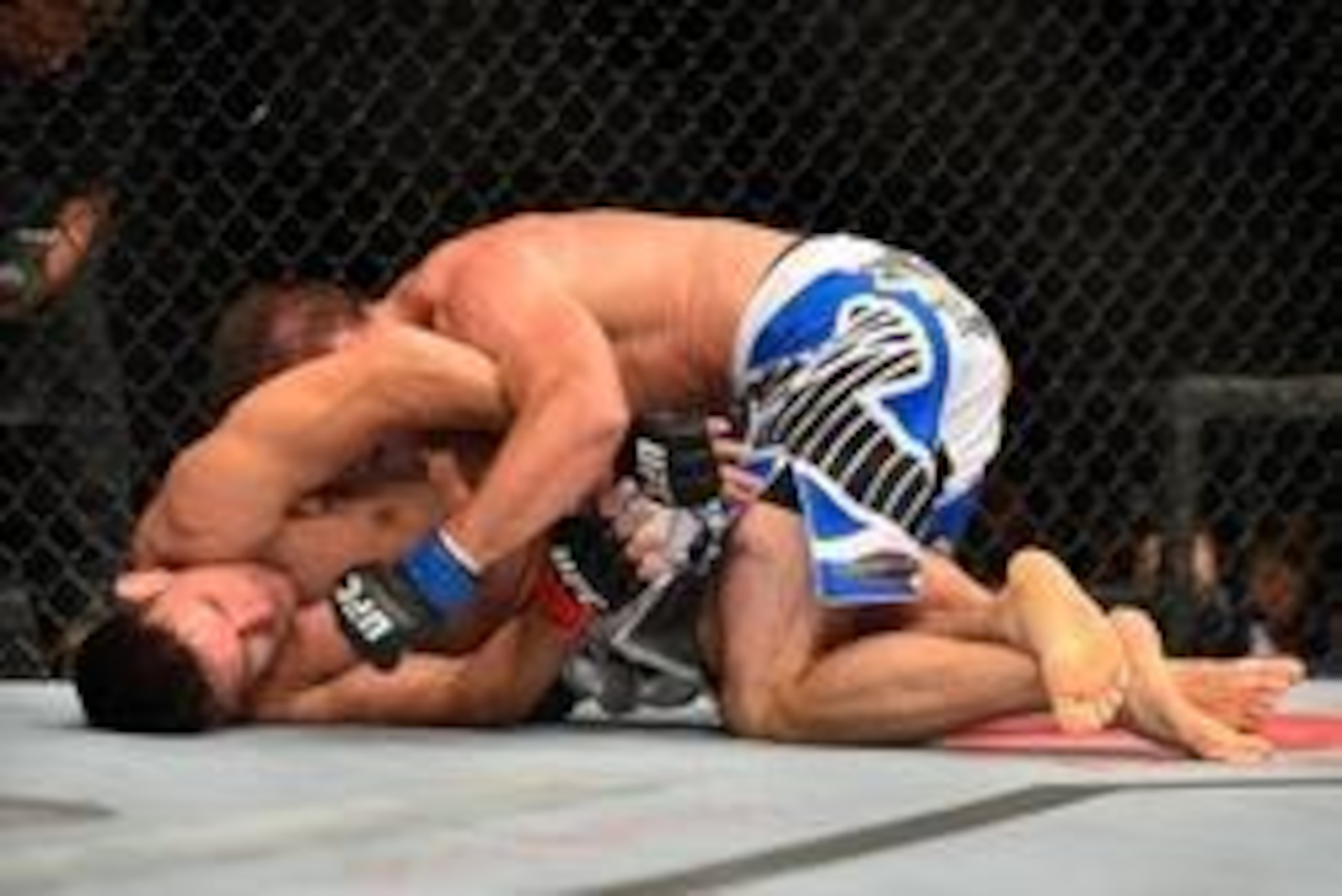 Oct 9, 2013; Barueri, Sao Paulo, Brazil; Demian Maia (red gloves) fights against Jake Shields (blue gloves) during UFC Fight Night 29 at Jose Correa Arena. Mandatory Credit: Jason Silva-USA TODAY Sports