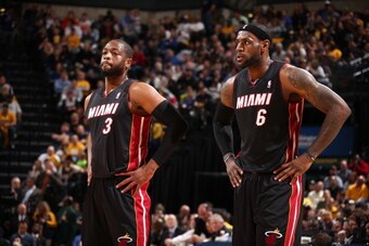 INDIANAPOLIS, IN - MARCH 26: Dwyane Wade #3 and LeBron James #6 of the Miami Heat stand on the court during a game against the Indiana Pacers on March 26, 2014 at Bankers Life Fieldhouse in Indianapolis, IN.  NOTE TO USER: User expressly acknowledges and 
