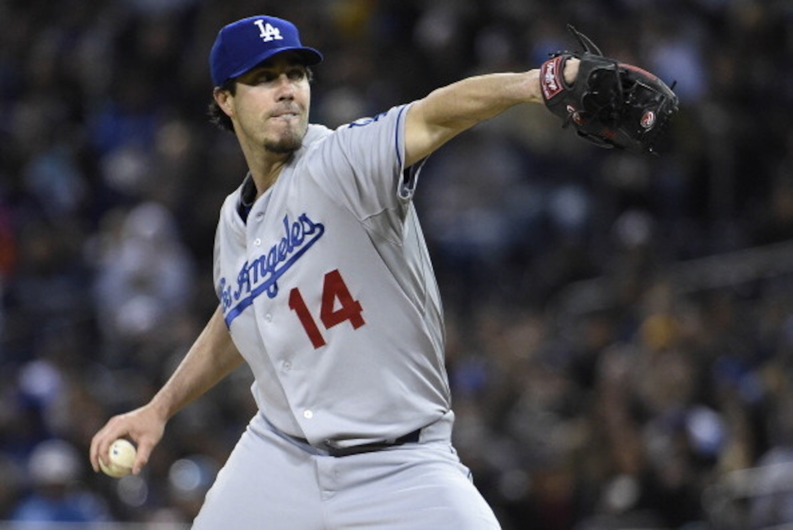 SAN DIEGO, CA - APRIL 2:  Dan Haren #14 of the Los Angeles Dodgers pitches during the first inning of a baseball game against the San Diego Padres at Petco Park April 2, 2014 in San Diego, California.  (Photo by Denis Poroy/Getty Images)