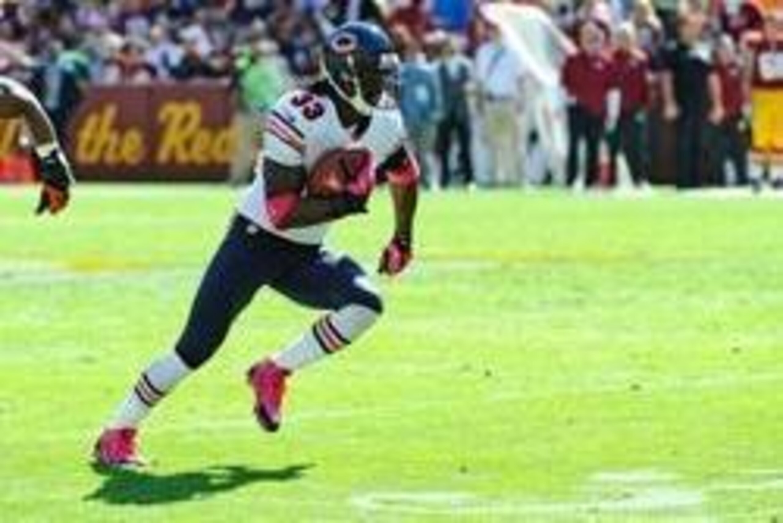 Oct 20, 2013; Landover, MD, USA; Chicago Bears cornerback Charles Tillman (33) runs after an interception against the Washington Redskins during the first half at FedEX Field. Mandatory Credit: Brad Mills-USA TODAY Sports