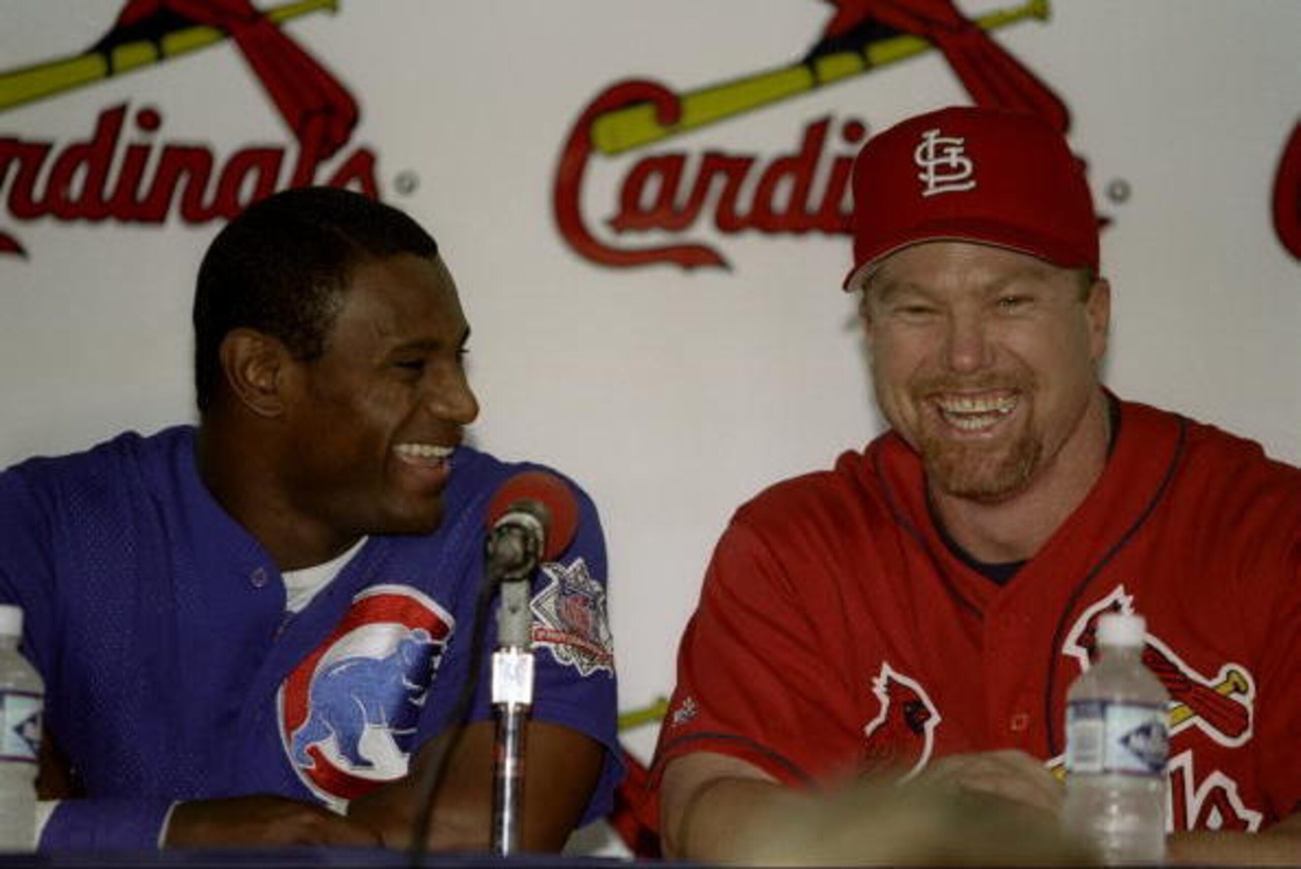 7 Sep 1998: Sammy Sosa #21 of the Chicago Cubs laughs with Mark McGwire #25 of the St Louis Cardinals during a press conference after the game against the Chicago Cubs at Busch Stadium in St Louis, Missouri. The Cardinals defeated the Cubs 3-2