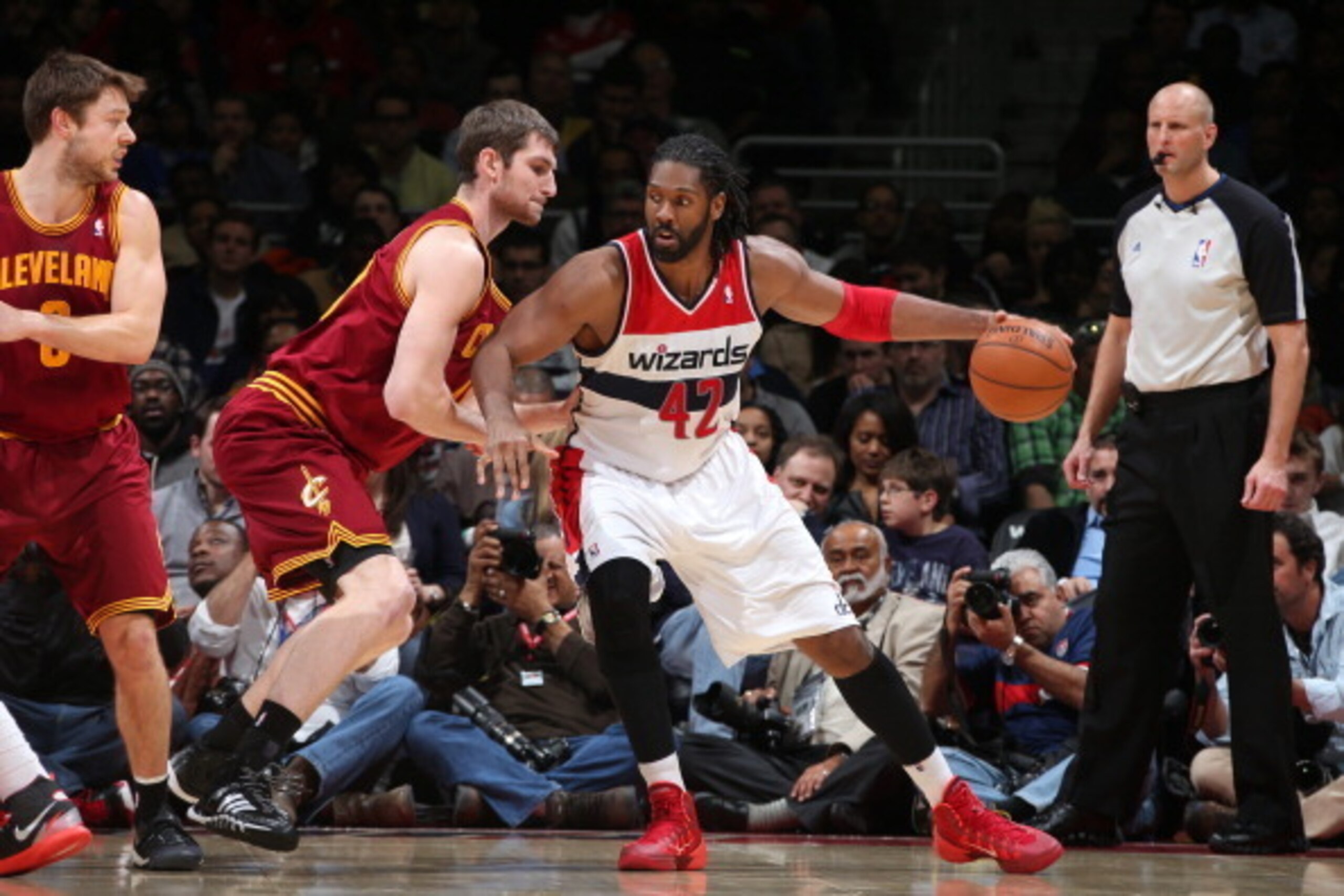 WASHINGTON, DC - FEBRUARY 7: Nene #42 of the Washington Wizards drives against Tyler Zeller #40 of the Cleveland Cavaliers during the game at the Verizon Center on February 7, 2014 in Washington, DC. NOTE TO USER: User expressly acknowledges and agrees th