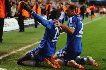 LONDON, ENGLAND - APRIL 08:  Demba Ba of Chelsea celebrates scoring their second goal with Branislav Ivanovic of Chelsea  during the UEFA Champions League Quarter Final second leg match between Chelsea and Paris Saint-Germain FC at Stamford Bridge on Apri