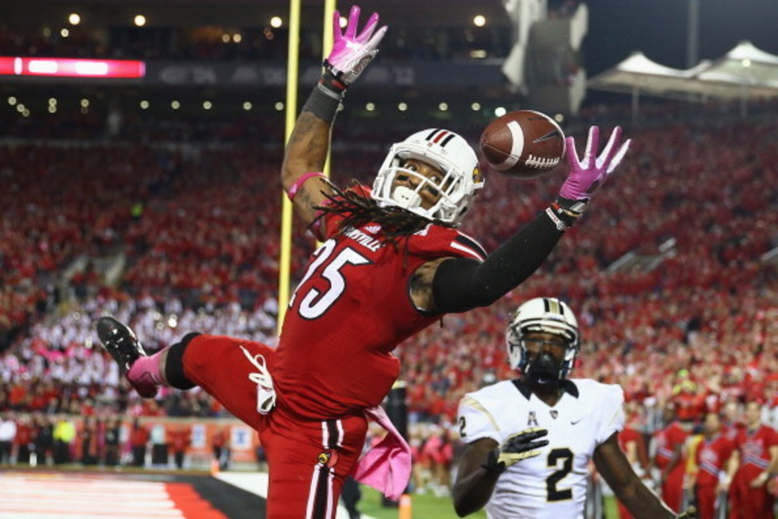 LOUISVILLE, KY - OCTOBER 18:  Calvin Pryor #25 of the Louisville Cardinals intercepts a pass in the end zone during the game against the Central Florida Knights at Papa John's Cardinal Stadium on October 18, 2013 in Louisville, Kentucky.  (Photo by Andy L