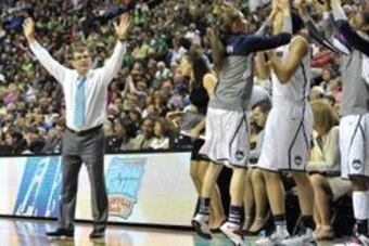 Apr 8, 2014; Nashville, TN, USA; Connecticut Huskies head coach Geno Auriemma and his team react in the second half of the championship game against the Notre Dame Fighting Irish in the Final Four in the 2014 NCAA Womens Division I Championship tournament