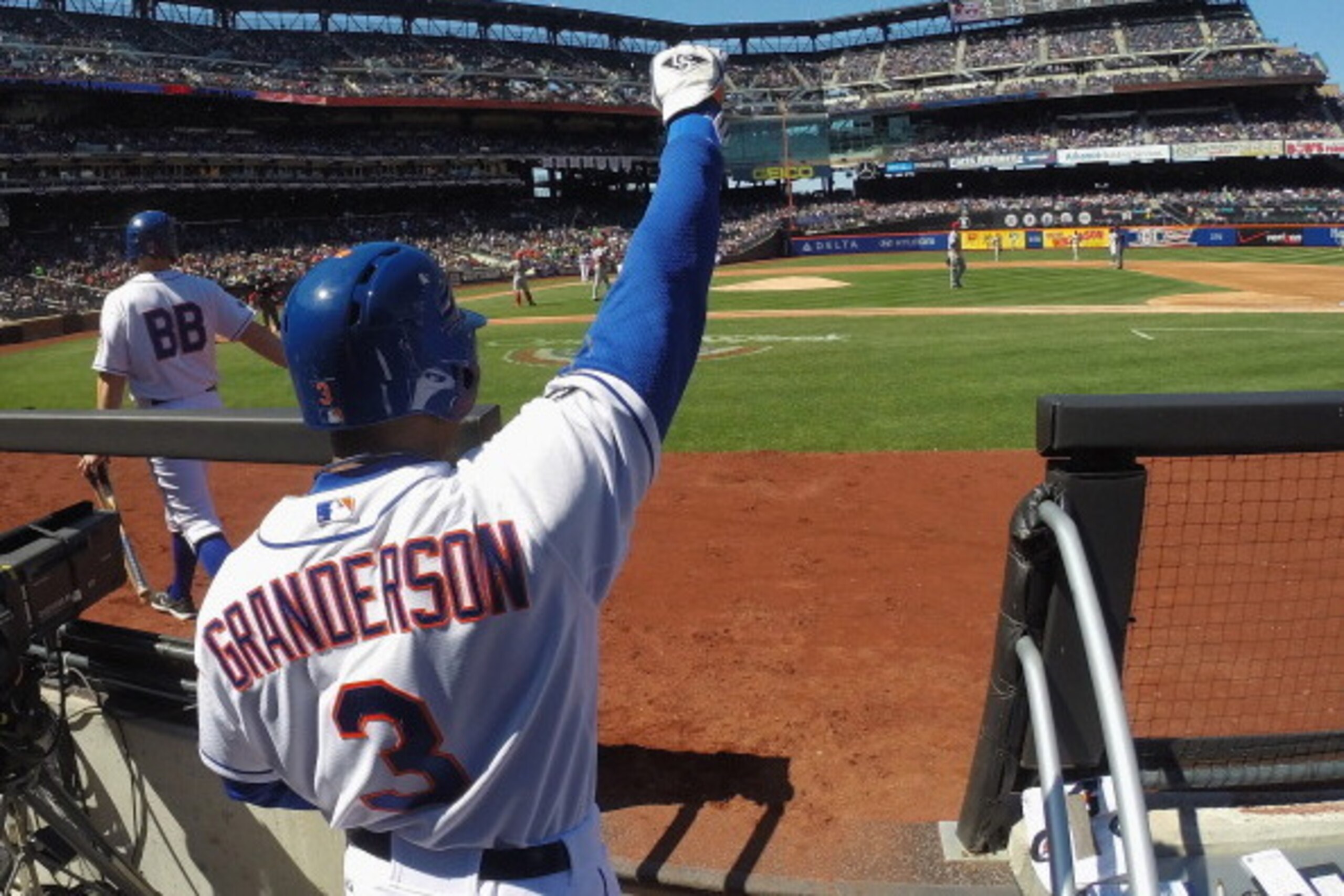 NEW YORK, NY - APRIL 06:  Curtis Granderson #3 of the New York Mets celebrates a run in the second inning against the Cincinnati Reds during their game on April 6, 2013 at Citi Field in the Flushing neighborhood of the Queens borough of New York City  (Ph