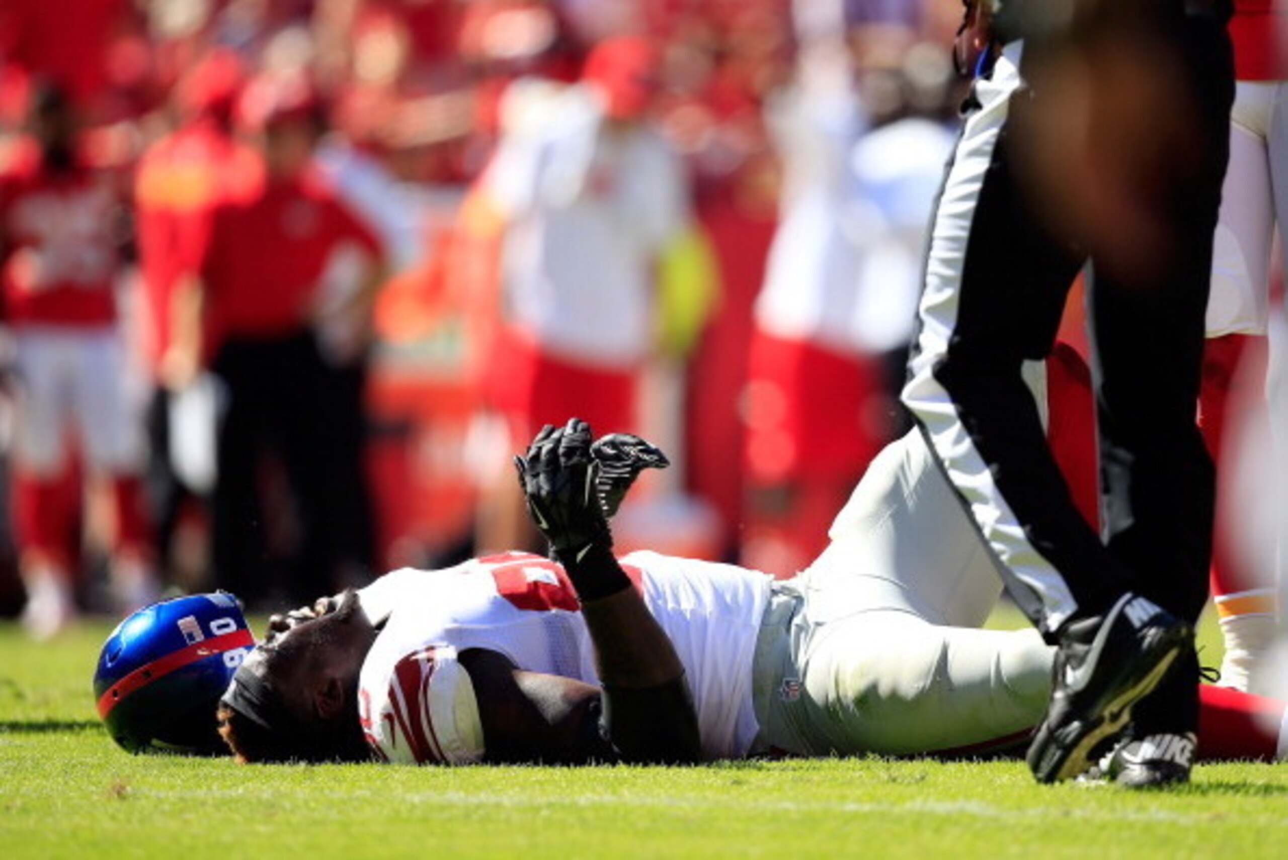 KANSAS CITY, MO - SEPTEMBER 29:  Defensive end Jason Pierre-Paul #90 of the New York Giants lies on the ground hurt during the against the Kansas City Chiefs game at Arrowhead Stadium on September 29, 2013 in Kansas City, Missouri.  (Photo by Jamie Squire