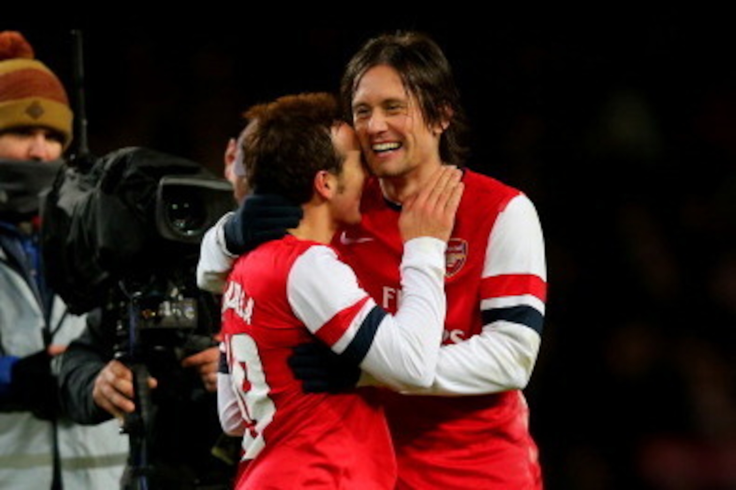 LONDON, ENGLAND - JANUARY 04: Arsenal goalscorers Santi Cazorla (L) and Tomas Rosicky (R) celebrate their team's 2-0 victory during the Budweiser FA Cup third round match between Arsenal and Tottenham Hotspur at Emirates Stadium on January 4, 2014 in Lo LONDON, ENGLAND - JANUARY 04: Arsenal goalscorers Santi Cazorla (L) and Tomas Rosicky (R) celebrate their team's 2-0 victory during the Budweiser FA Cup third round match between Arsenal and Tottenham Hotspur at Emirates Stadium on January 4, 2014 in Lo