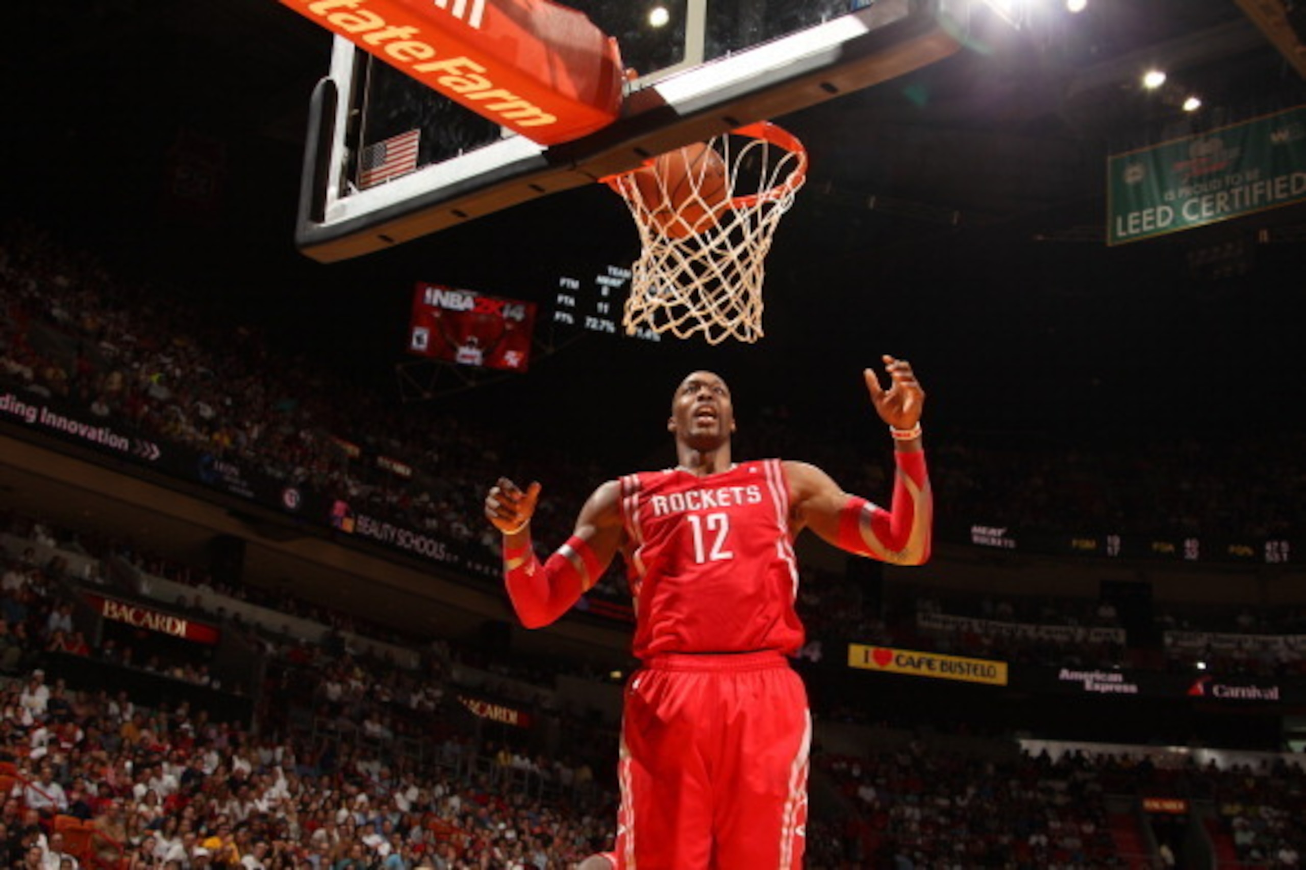 MIAMI, FL - March 16: Dwight Howard #12 of the Houston Rockets dunks the ball against the Miami Heat at the American Airlines Arena in Miami, Florida on March 16 2014. NOTE TO USER: User expressly acknowledges and agrees that, by downloading and/or using MIAMI, FL - March 16: Dwight Howard #12 of the Houston Rockets dunks the ball against the Miami Heat at the American Airlines Arena in Miami, Florida on March 16 2014. NOTE TO USER: User expressly acknowledges and agrees that, by downloading and/or using