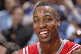 OAKLAND, CA - FEBRUARY 20: Dwight Howard #12 of the Houston Rockets smiles during the game against the Golden State Warriors on February 20, 2014 at Oracle Arena in Oakland, California. NOTE TO USER: User expressly acknowledges and agrees that, by downloa