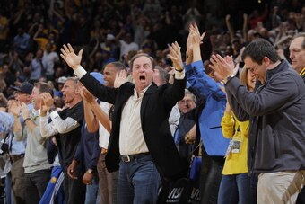 OAKLAND, CA - MARCH 11: Golden State Warriors owner Joe Lacob celebrates while his team faces the Dallas Mavericks on March 11, 2014 at Oracle Arena in Oakland, California. NOTE TO USER: User expressly acknowledges and agrees that, by downloading and or u