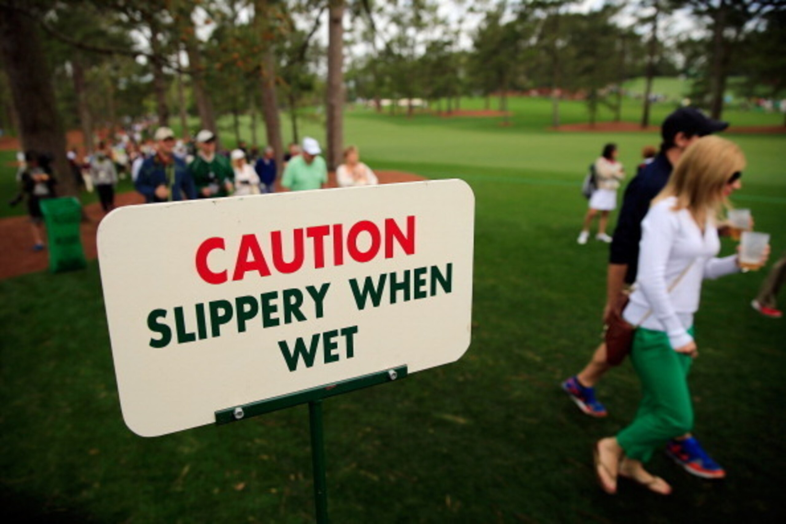 AUGUSTA, GA - APRIL 08:  Golf fans watch the play near the seventh hole during a practice round prior to the start of the 2014 Masters Tournament at Augusta National Golf Club on April 8, 2014 in Augusta, Georgia.  (Photo by Rob Carr/Getty Images)