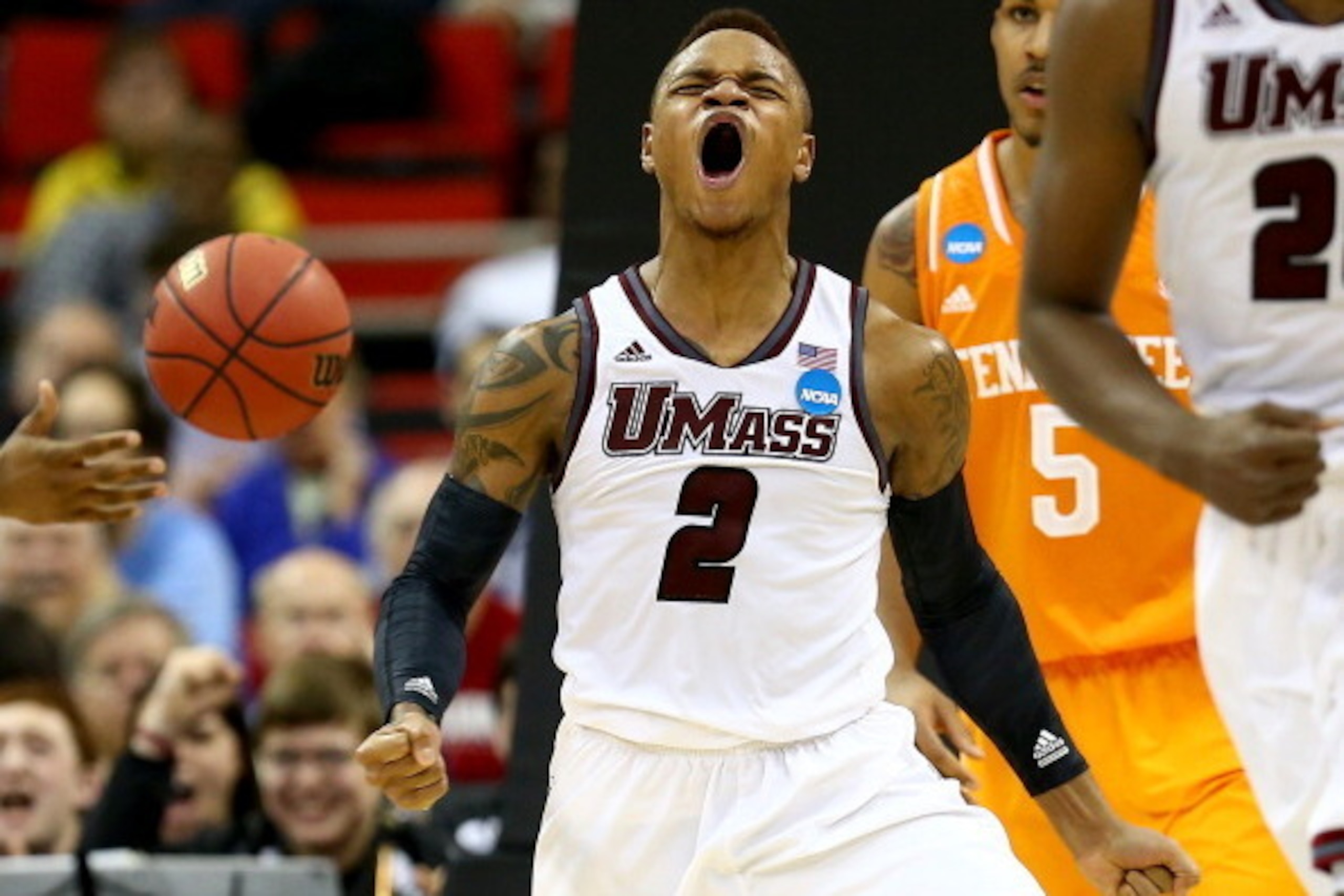 RALEIGH, NC - MARCH 21:  Derrick Gordon #2 of the Massachusetts Minutemen reacts while taking on the Tennessee Volunteers in the second round of the 2014 NCAA Men's Basketball Tournament at PNC Arena on March 21, 2014 in Raleigh, North Carolina.  (Photo b