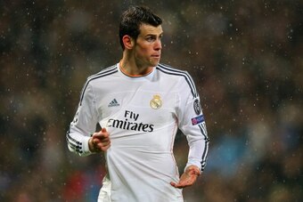 MADRID, SPAIN - APRIL 02: Gareth Bale of Real Madrid reacts to a challenge during the UEFA Champions League Quarter Final first leg match between Real Madrid and Borussia Dortmund at Estadio Santiago Bernabeu on April 2, 2014 in Madrid, Spain. (Photo by MADRID, SPAIN - APRIL 02: Gareth Bale of Real Madrid reacts to a challenge during the UEFA Champions League Quarter Final first leg match between Real Madrid and Borussia Dortmund at Estadio Santiago Bernabeu on April 2, 2014 in Madrid, Spain. (Photo by