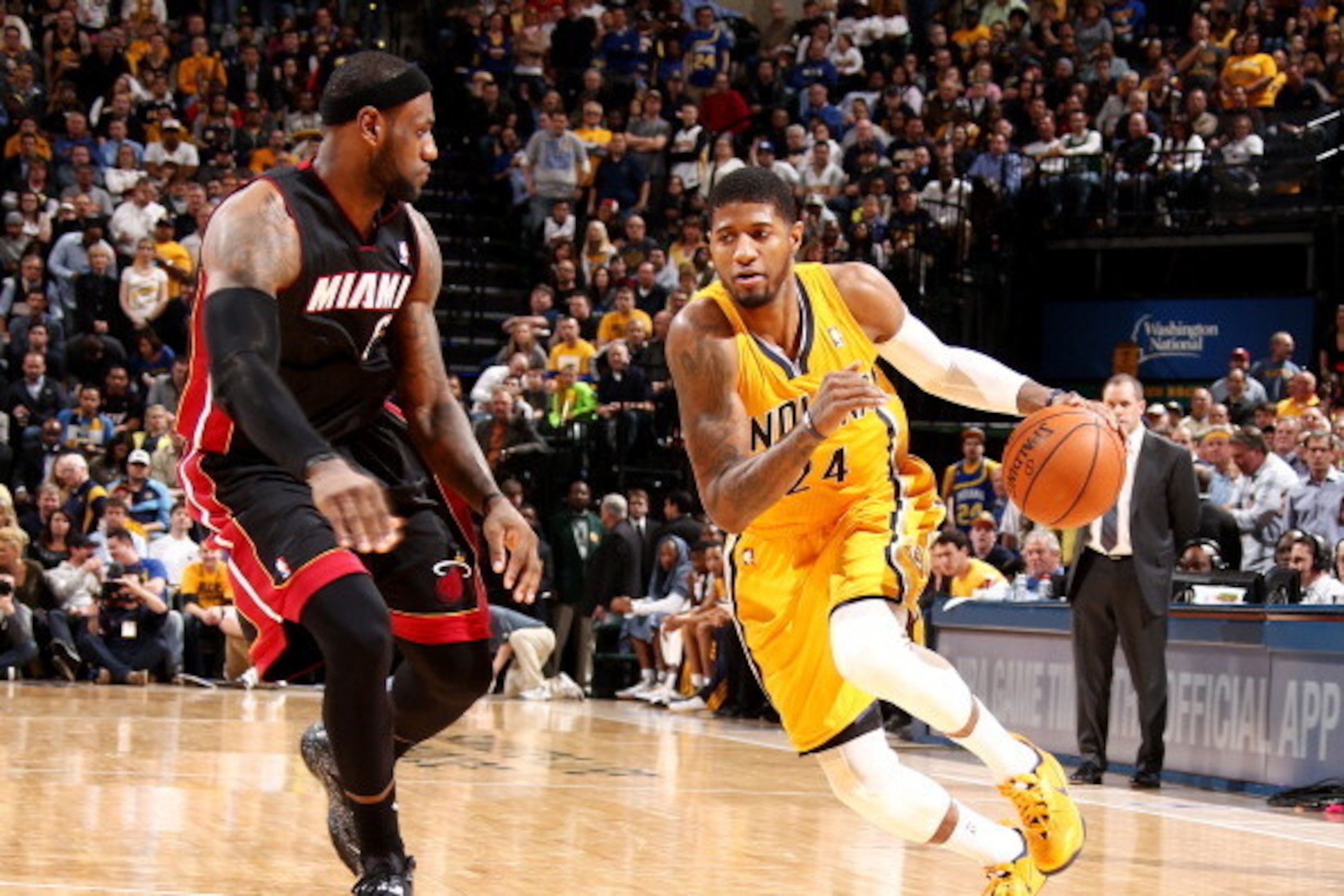 INDIANAPOLIS, IN - MARCH 26: Paul George #24 of the Indiana Pacers drives against LeBron James #6 of the Miami Heat during a game on March 26, 2014 at Bankers Life Fieldhouse in Indianapolis, IN.  NOTE TO USER: User expressly acknowledges and agrees that,