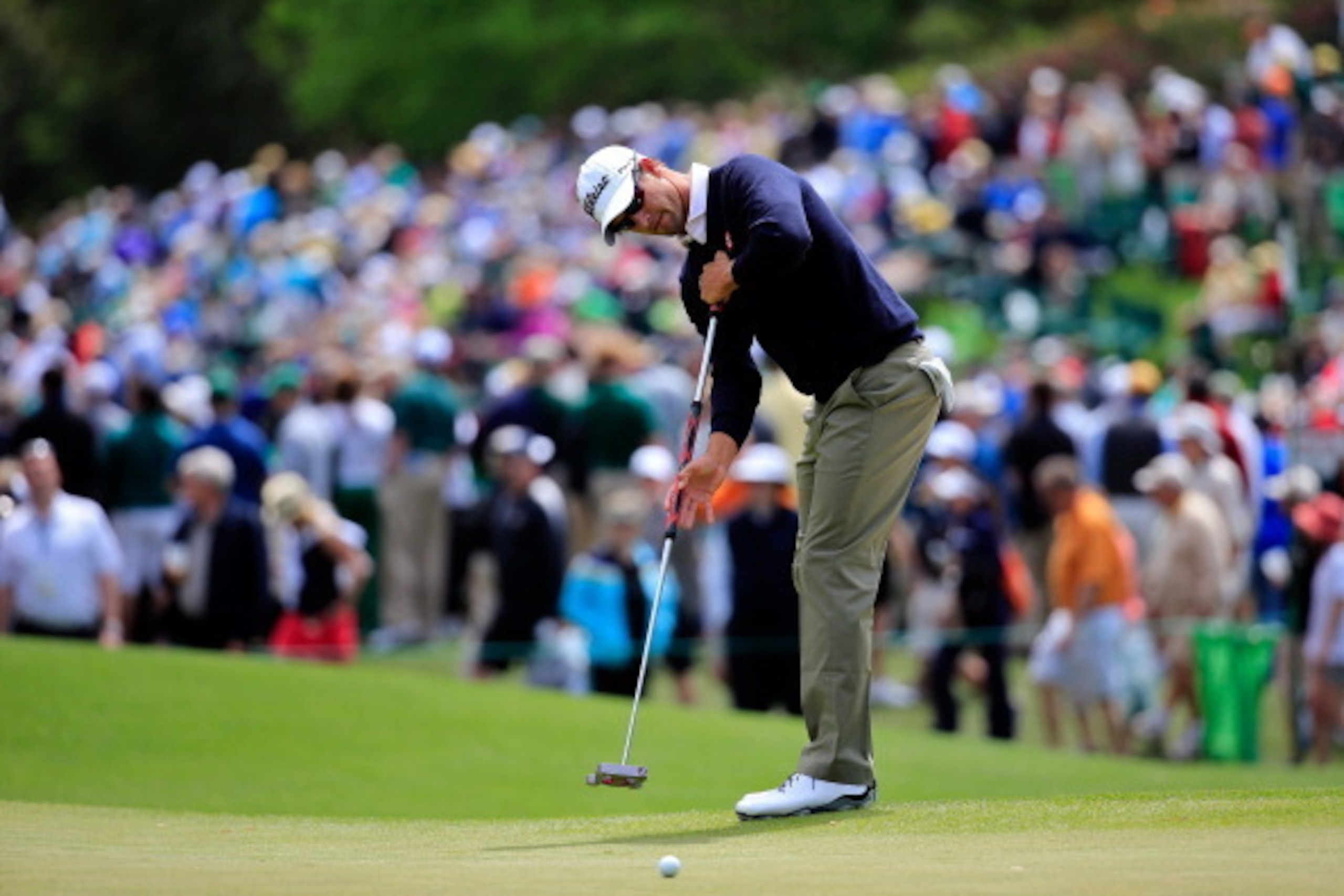 AUGUSTA, GA - APRIL 08:  Adam Scott of Australia watches a putt during a practice round prior to the start of the 2014 Masters Tournament at Augusta National Golf Club on April 8, 2014 in Augusta, Georgia.  (Photo by Rob Carr/Getty Images)