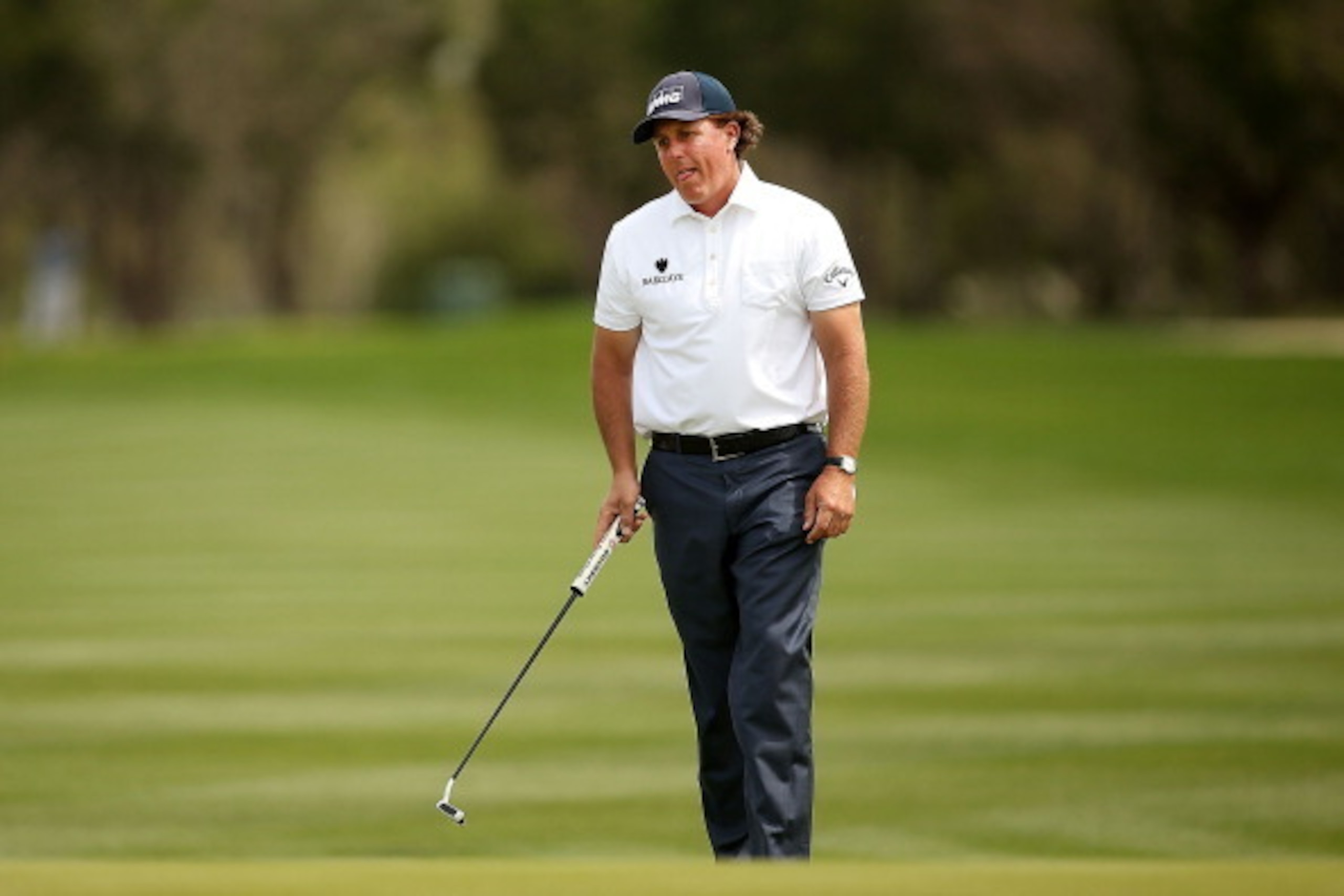 SAN ANTONIO, TX - MARCH 29:  Phil Mickelson takes his shot on the 14th before withdrawing two holes later on the 2nd due to a pulled muscle during Round Three of the Valero Texas Open at TPC San Antonio AT&T Oaks Course on March 29, 2014 in San Antonio, T
