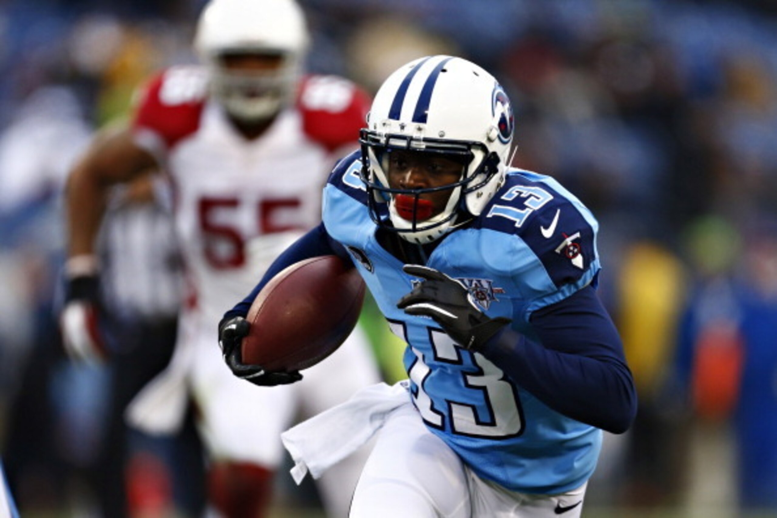 NASHVILLE, TN - DECEMBER 15:  Kendall Wright #13 of the Tennessee Titans runs the ball after catching a pass against the Arizona Cardinals at LP Field on December 15, 2013 in Nashville, Tennessee.  (Photo by Wesley Hitt/Getty Images)